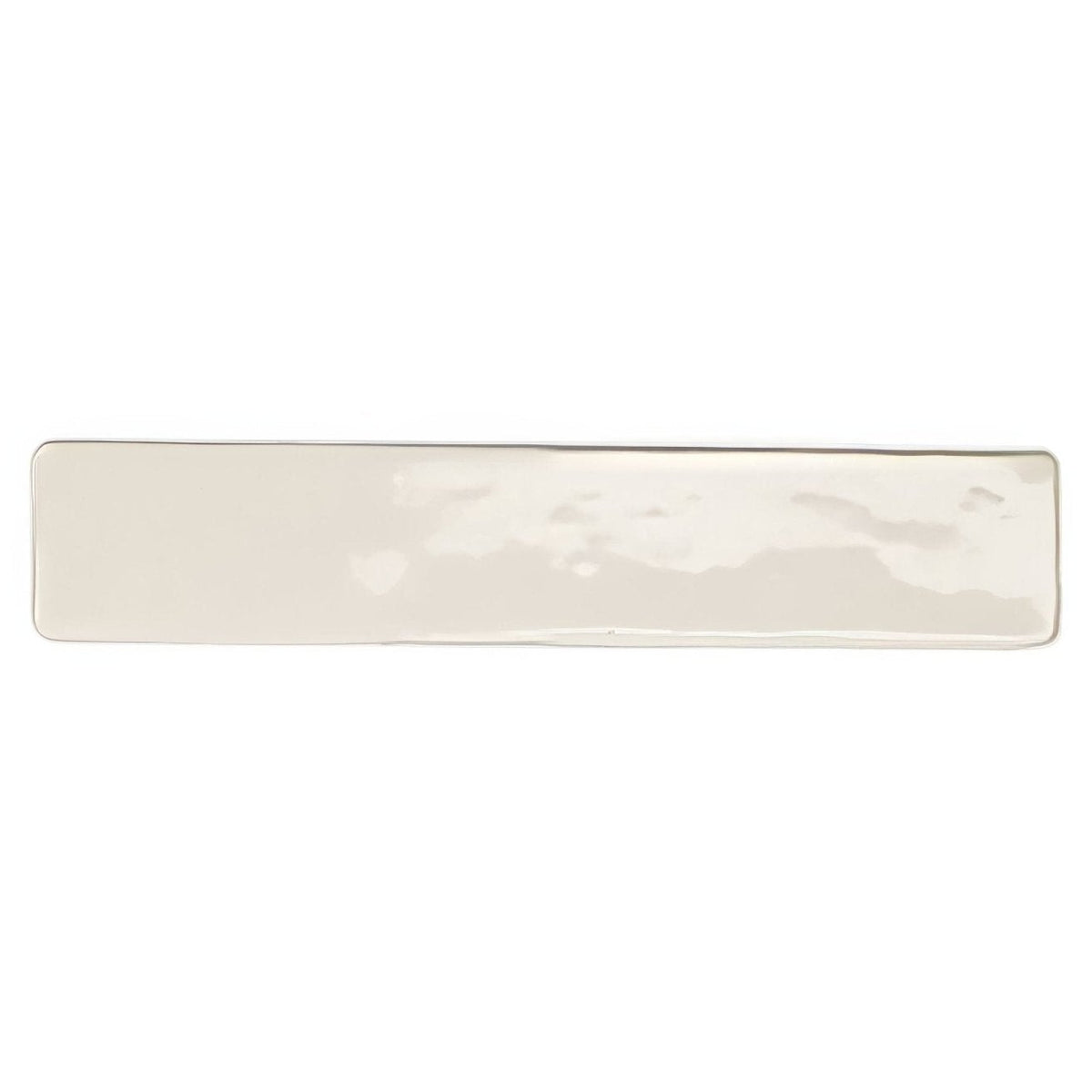 Cream-colored ceramic serving platter with subtle hammered texture from Nina Campbell Rivage ivory glazed wall tile collection