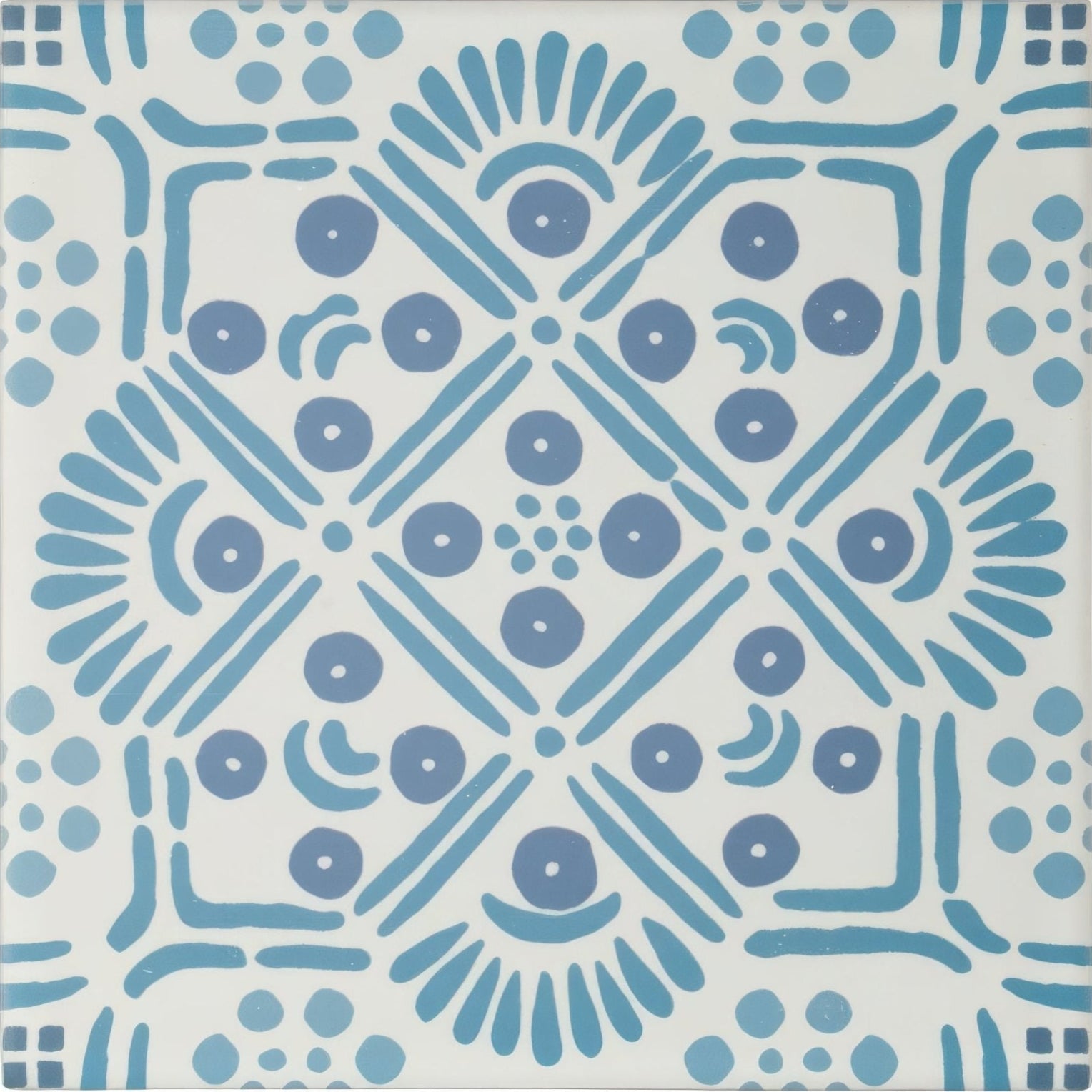 Blue and white patterned ceramic tile with symmetrical decorative design from nina campbell seville blue porcelain tile collection