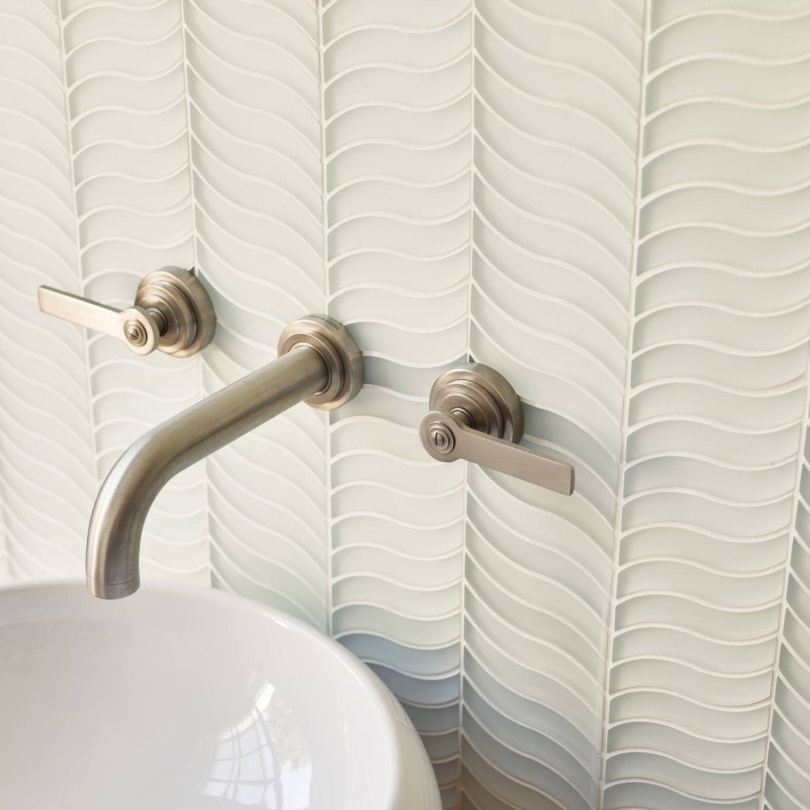 Nordic Glass Bergen Snow Mosaic white wavy glass mosaic with a brushed nickel tap