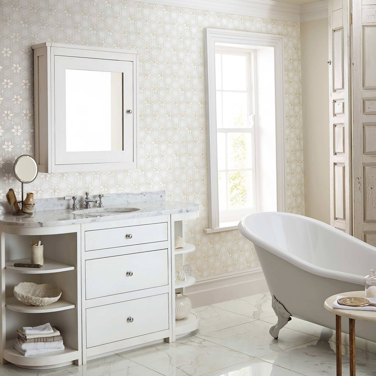 Bathroom with white vanity, freestanding bathtub, and large mirror with North Beach Montgomery Marble Effect Tile 60 x 60cm