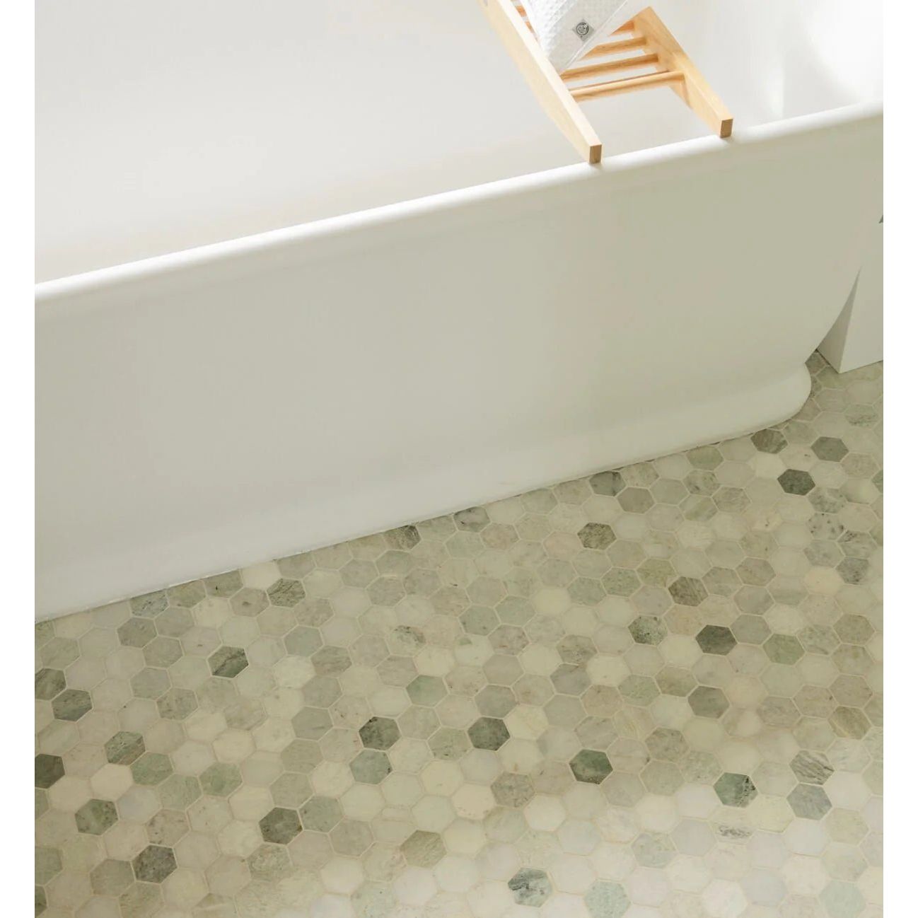 North Haven hexagon marble mosaic tile with beige gray and subtle green tones in a natural stone finish