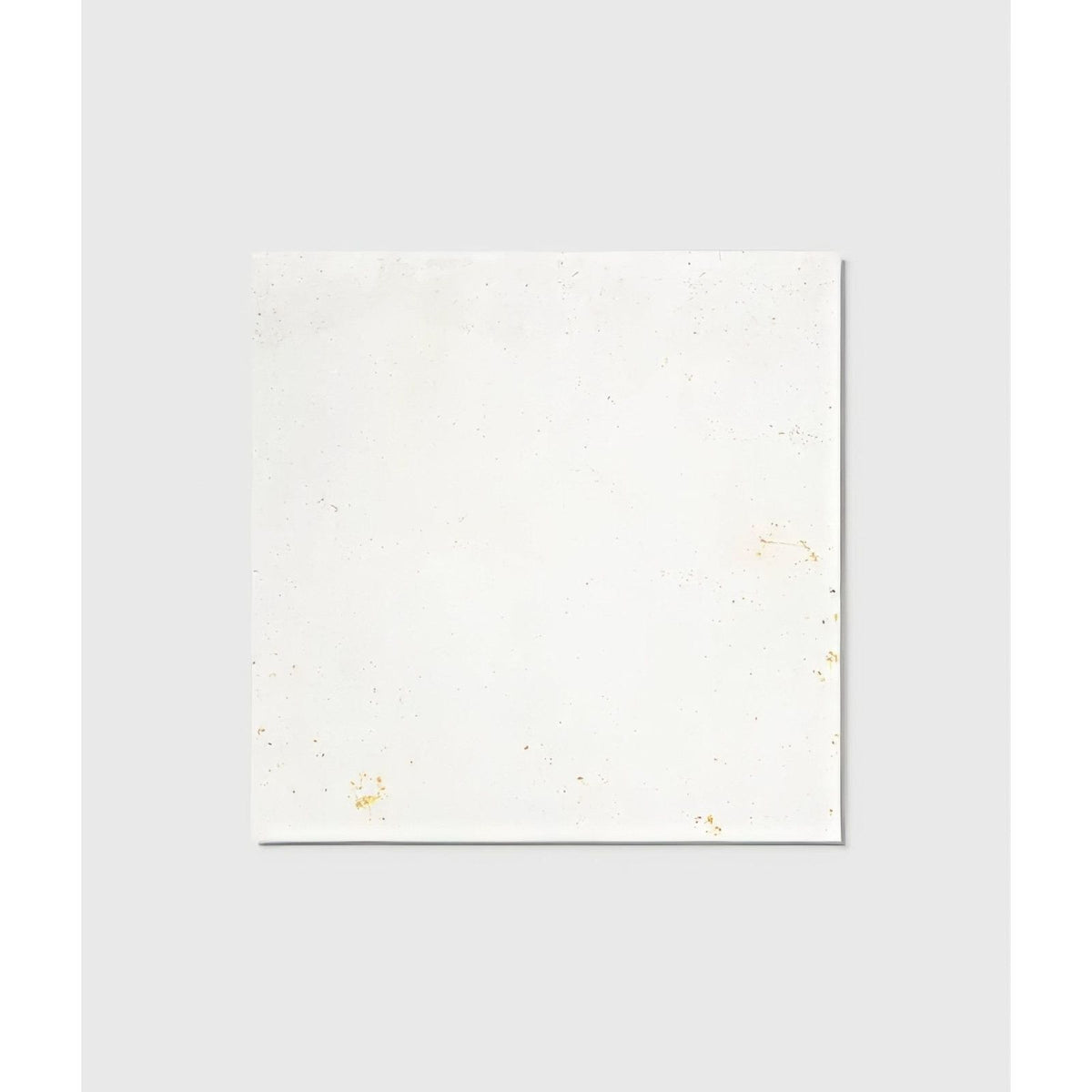 White ceramic tile from Nuance Ceramic with subtle gold speckles ideal for elegant wall or floor designs