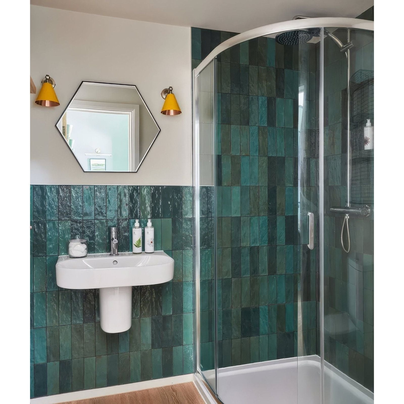Oasis ceramic green gloss bathroom with sleek curved glass shower enclosure and chrome handheld showerhead