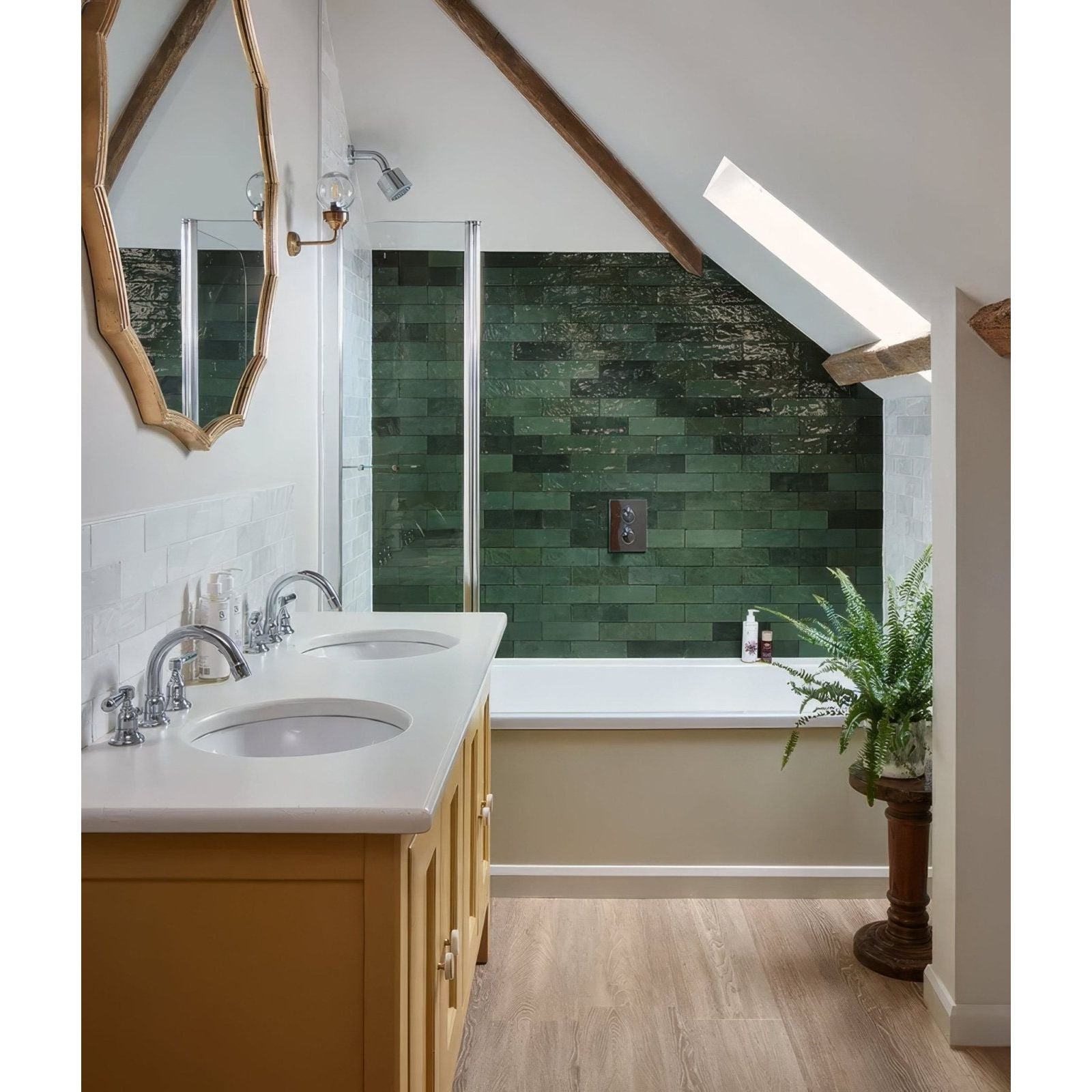 Green ceramic gloss rectangular tiles form a textured glossy backsplash behind the bathtub in oasis ceramic green gloss