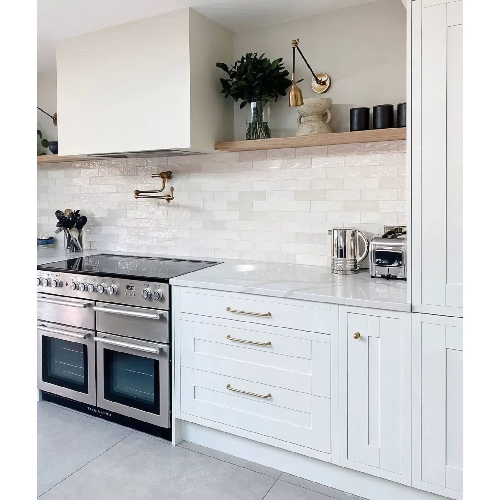 Stainless steel double oven with sleek modern design and silver handles in oasis ceramic white gloss finish
