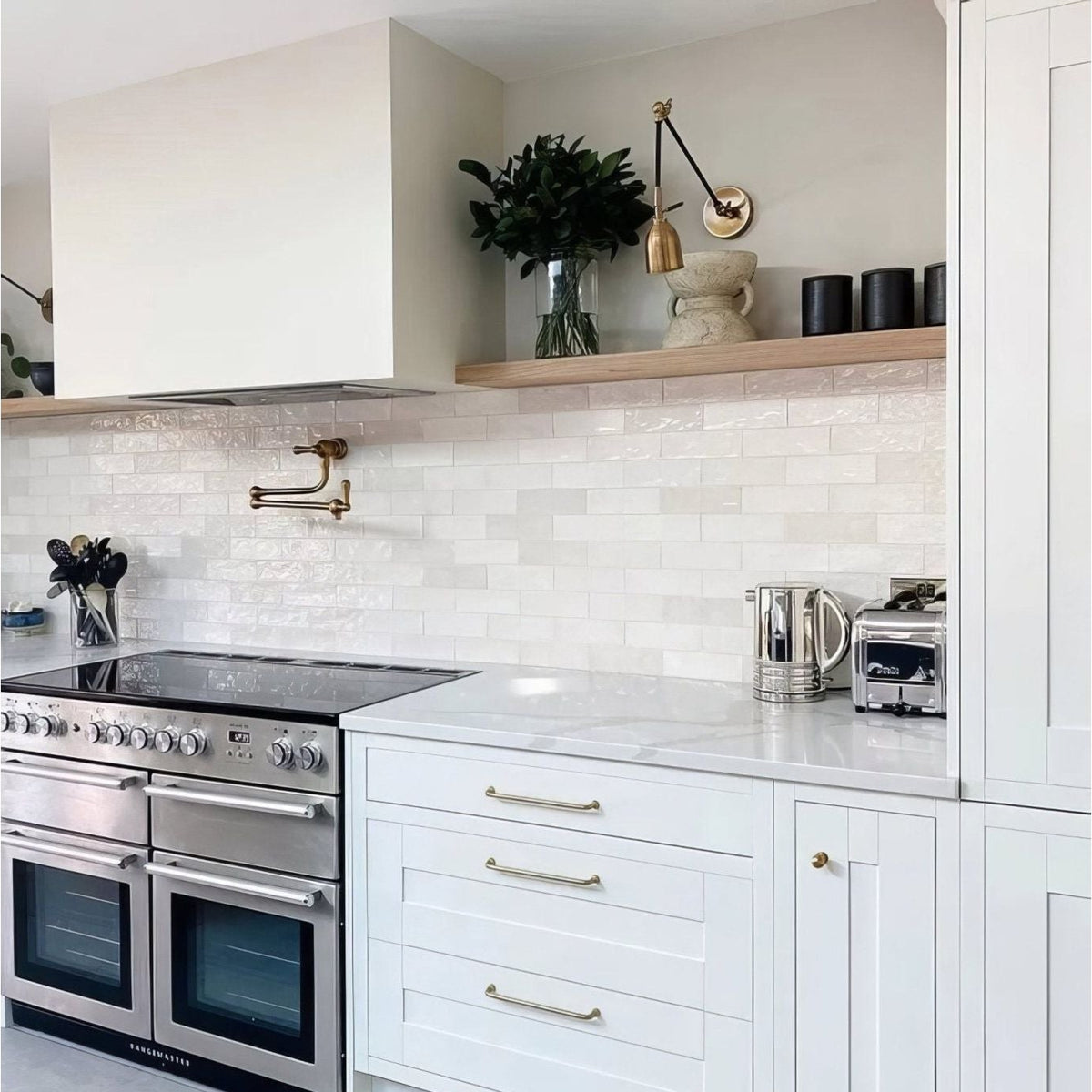 Stainless steel double oven with sleek modern design and silver handles in oasis ceramic white gloss finish