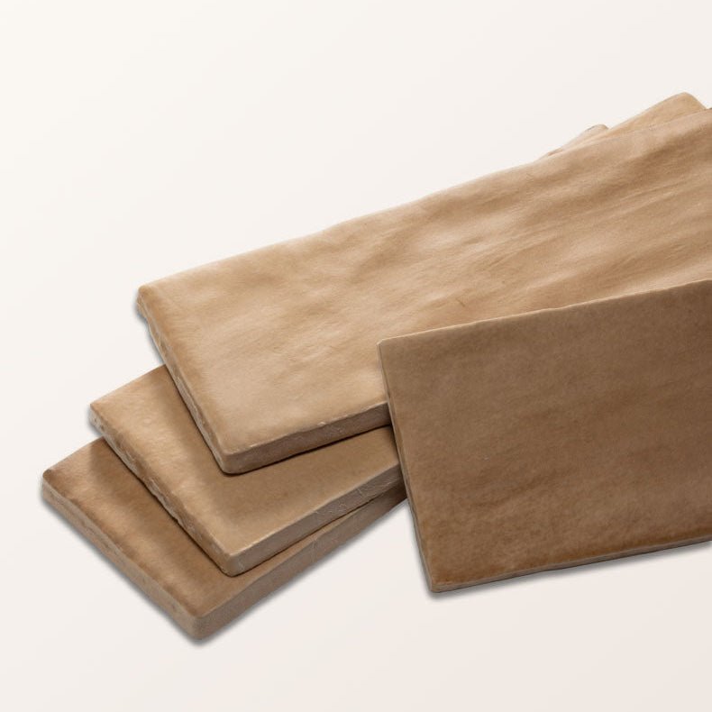 Tan rectangular stone tiles with textured matte finish made of ceramic from oasis veloute ceramic cotto matt collection