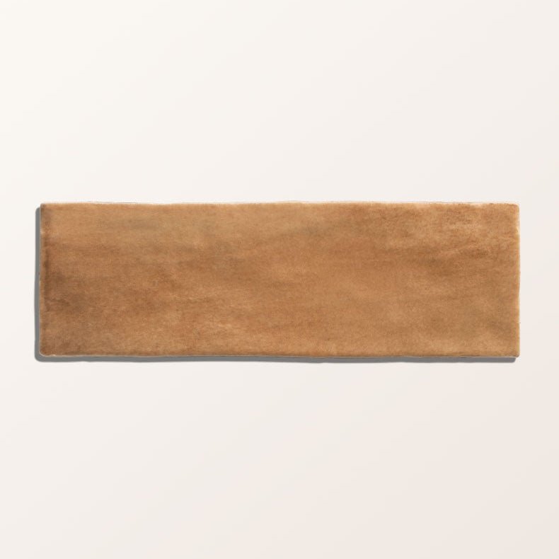 A rectangular tan ceramic tile with textured matte finish from oasis veloute cotto matt collection