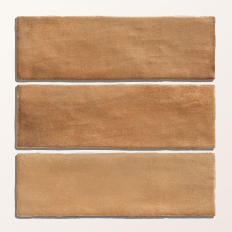 Three rectangular terracotta tiles with matte earthy brown finish and subtle texture from oasis veloute ceramic cotto matt