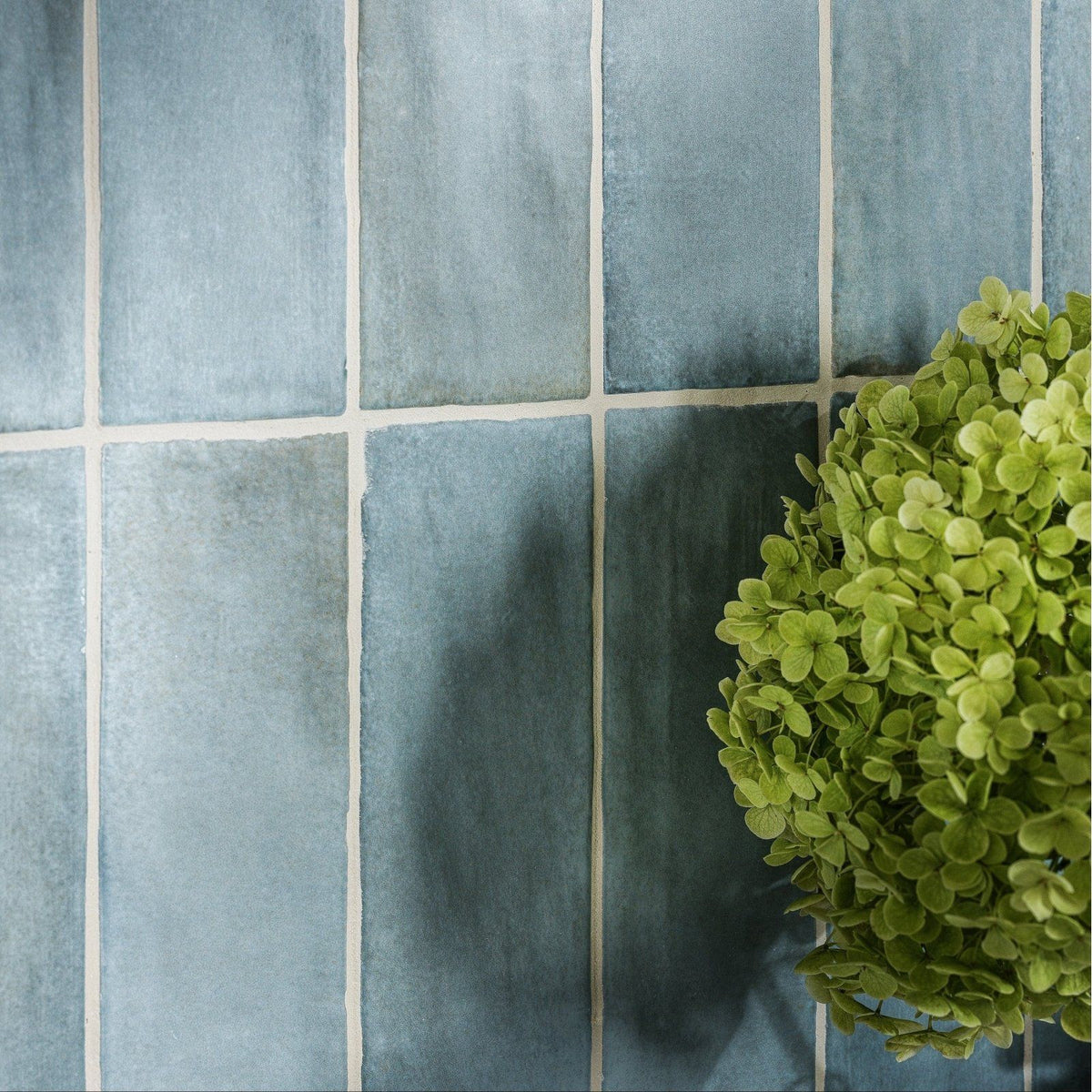 Blue rectangular oasis veloute ceramic power blue matt tiles with subtle texture and white grout lines