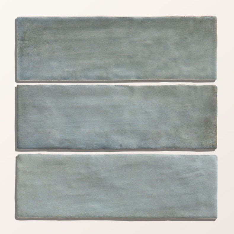 Three rectangular oasis veloute ceramic tiles in matte powder blue with a textured surface
