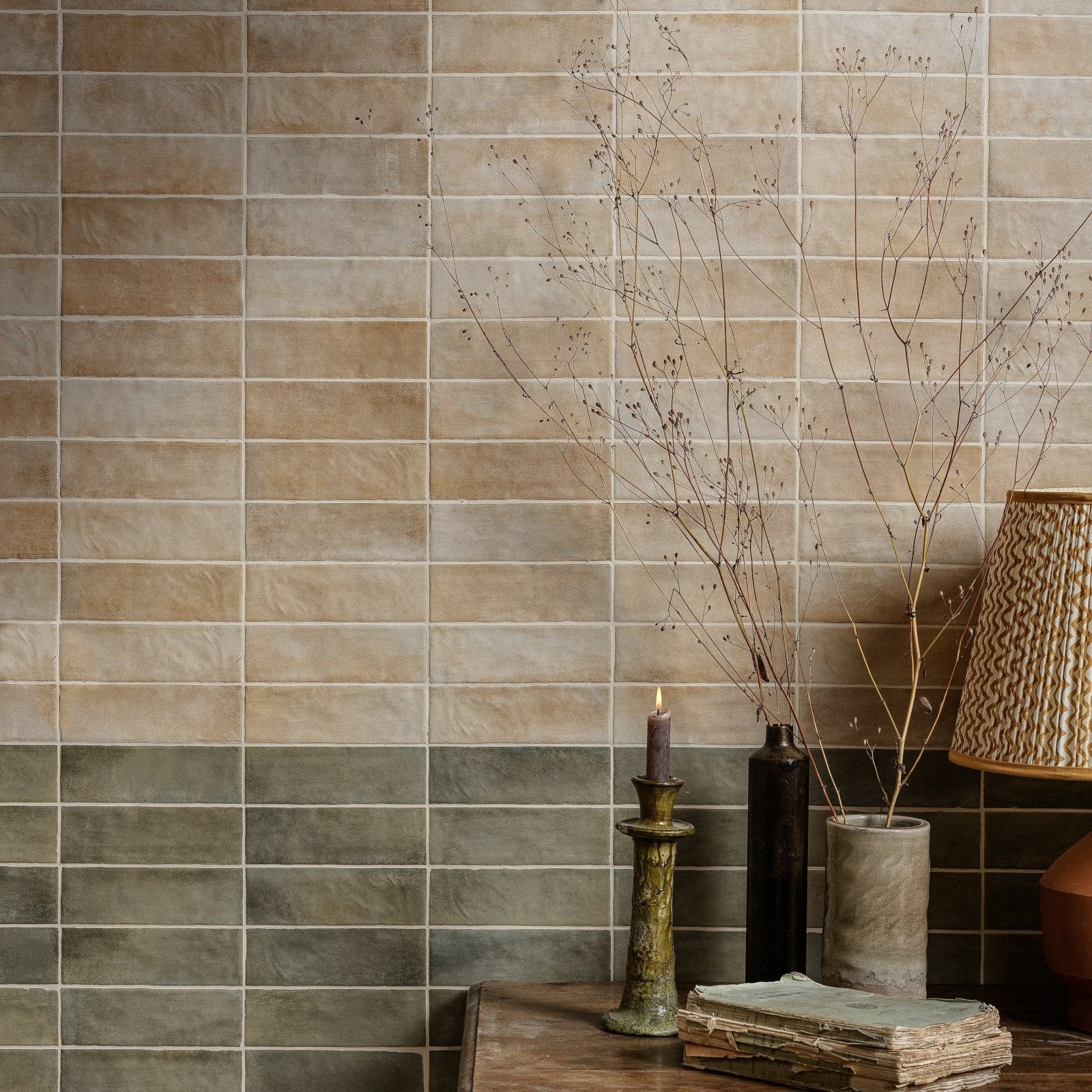 Beige and gray rectangular ceramic tiles with a subtle textured finish on the wall from oasis veloute ceramic sand matt collection