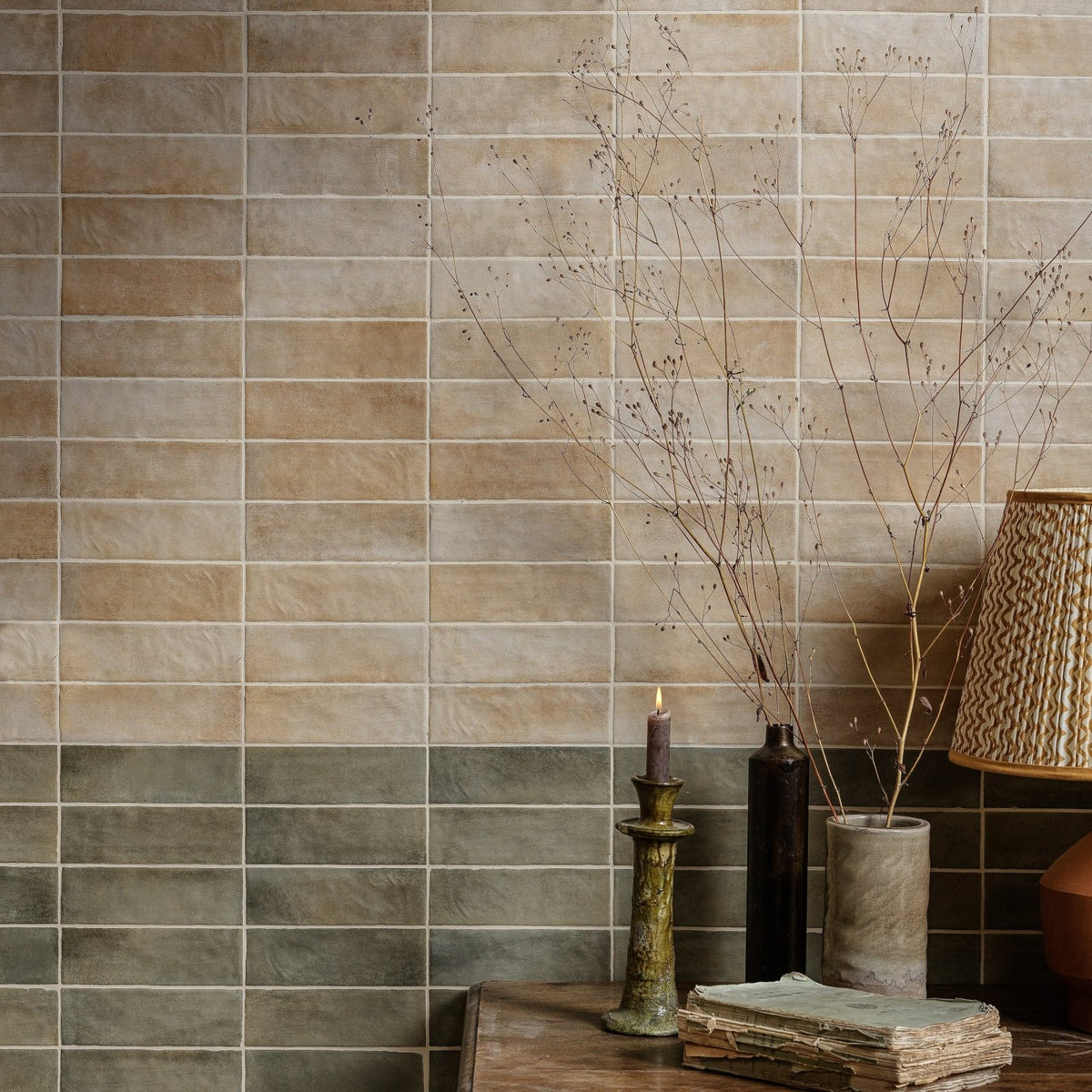 Beige and gray rectangular ceramic tiles with a subtle textured finish on the wall from oasis veloute ceramic sand matt collection