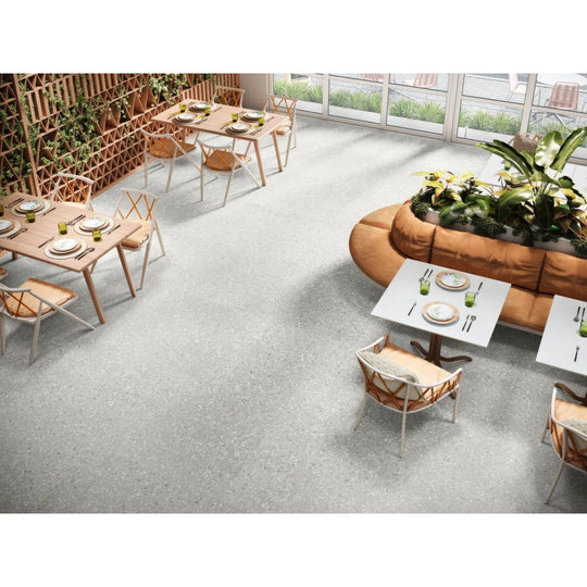 Gray speckled concrete floor named obi 1855 perla showcasing durable textured surface for modern interior use