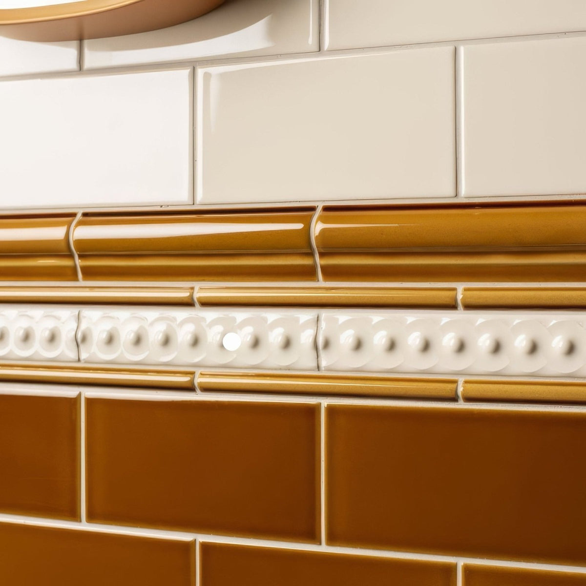 Cream and mustard yellow ceramic ochre half tile subway tiles with decorative white beaded border
