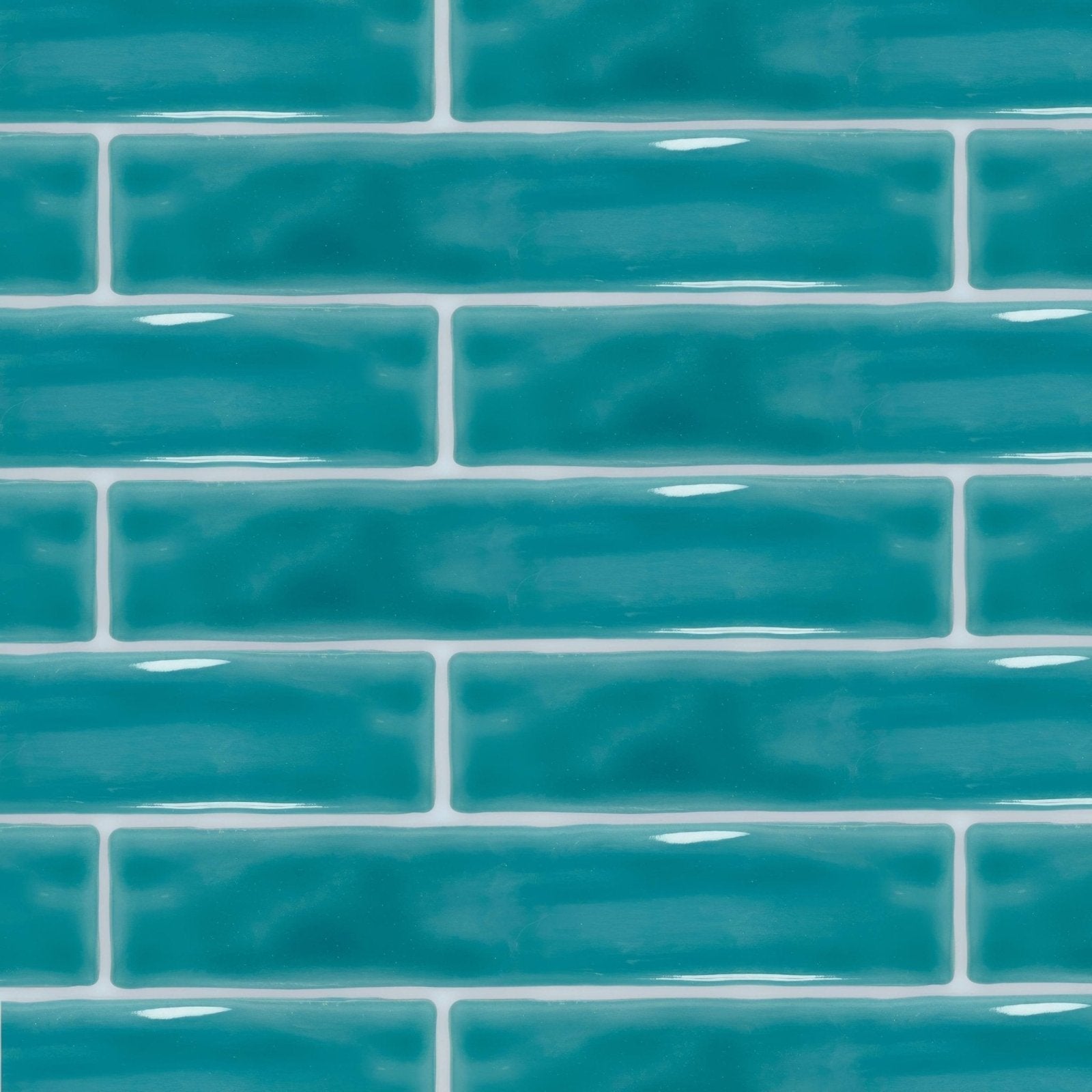 Vibrant teal glossy subway wall tiles with crisp white grout from onda aquamarine collection
