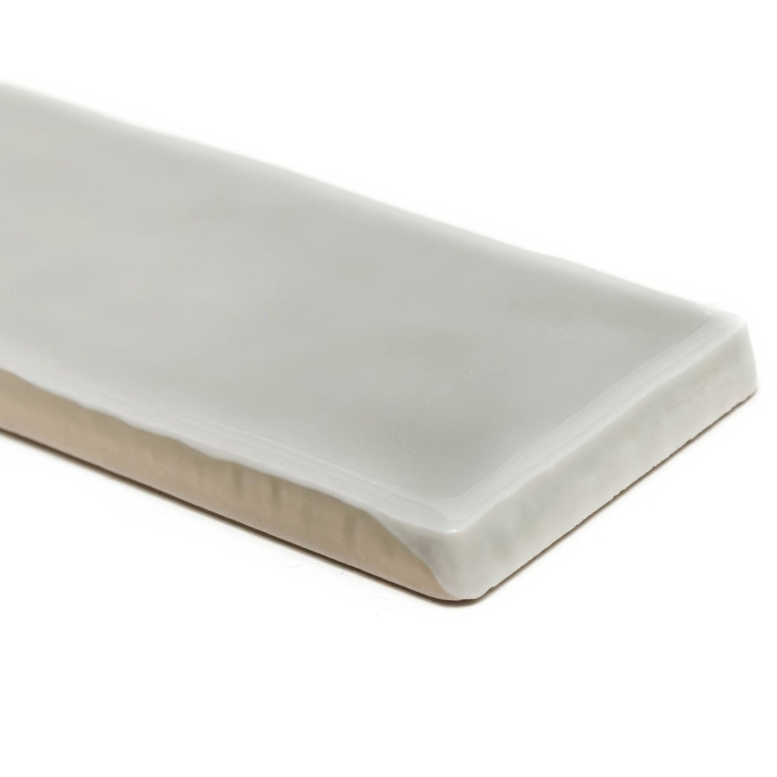 A sleek rectangular white ceramic onda chamelon wall tile with a smooth glossy finish and rounded edges