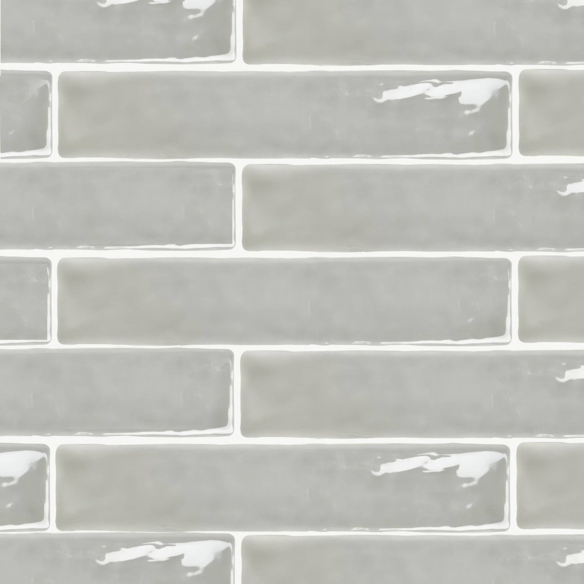 Onda chamelon wall tiles in gray glass subway style with a glossy finish and subtle white grout lines