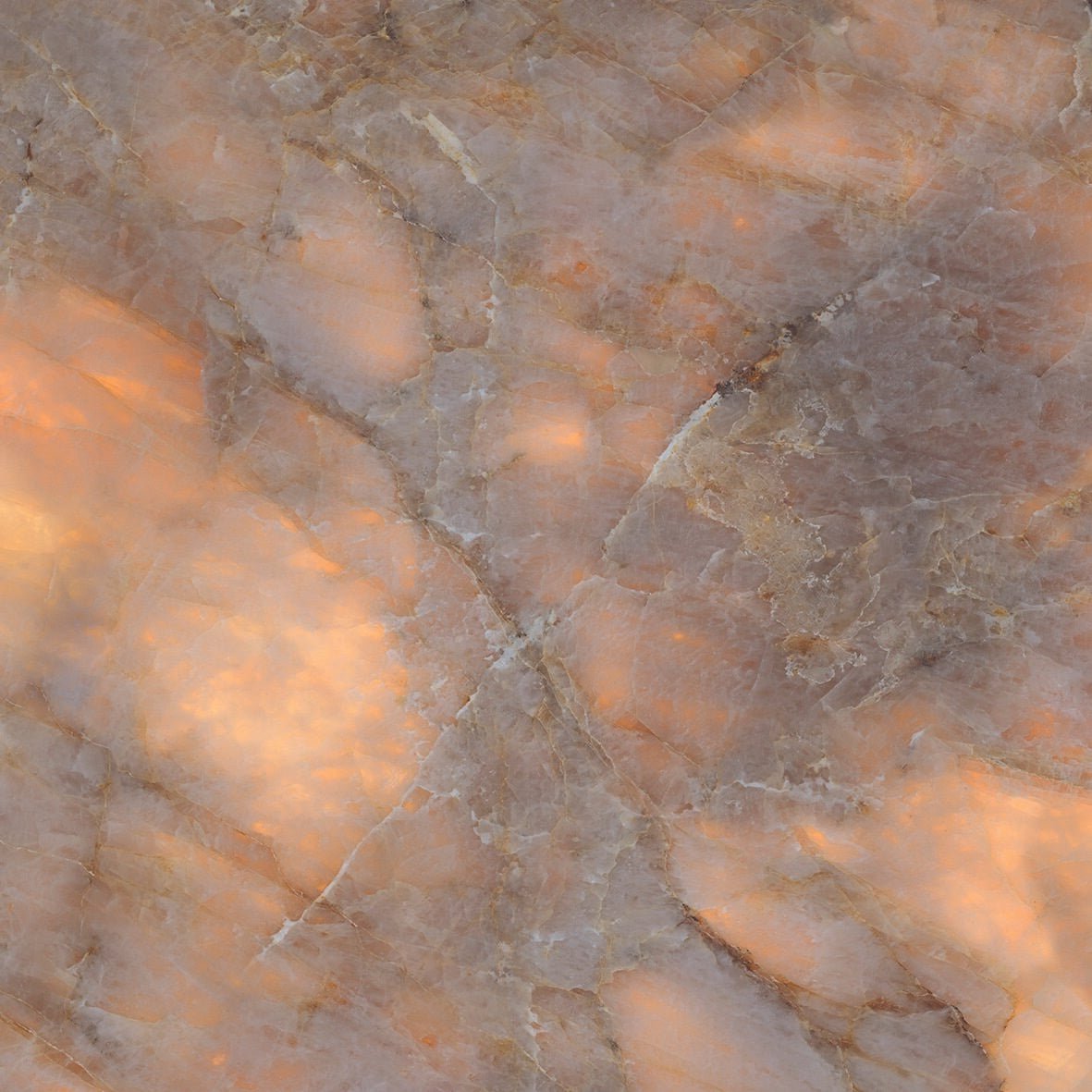 A luxurious onyx copper polished marble surface with peach and gray veins and a smooth polished finish