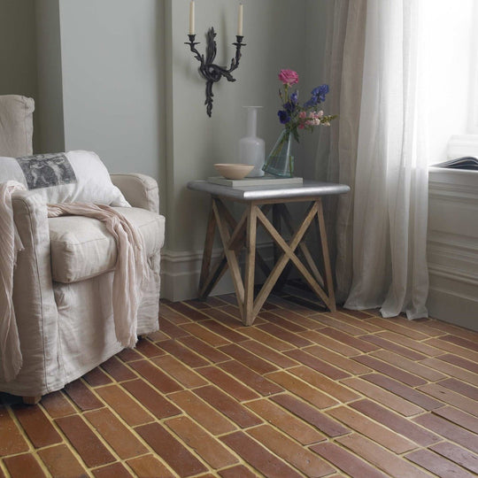 Opal green terracotta brick flooring with warm earthy tone and rustic textured surface for durable indoor use