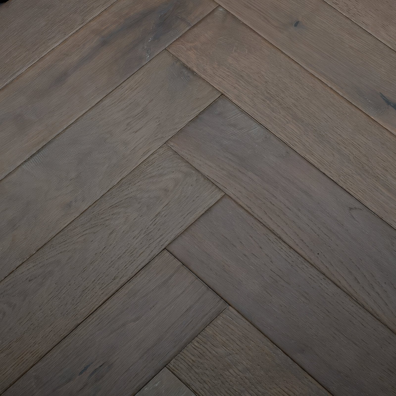 Dark gray herringbone pattern hardwood flooring in orkney truffle oak for modern interior spaces