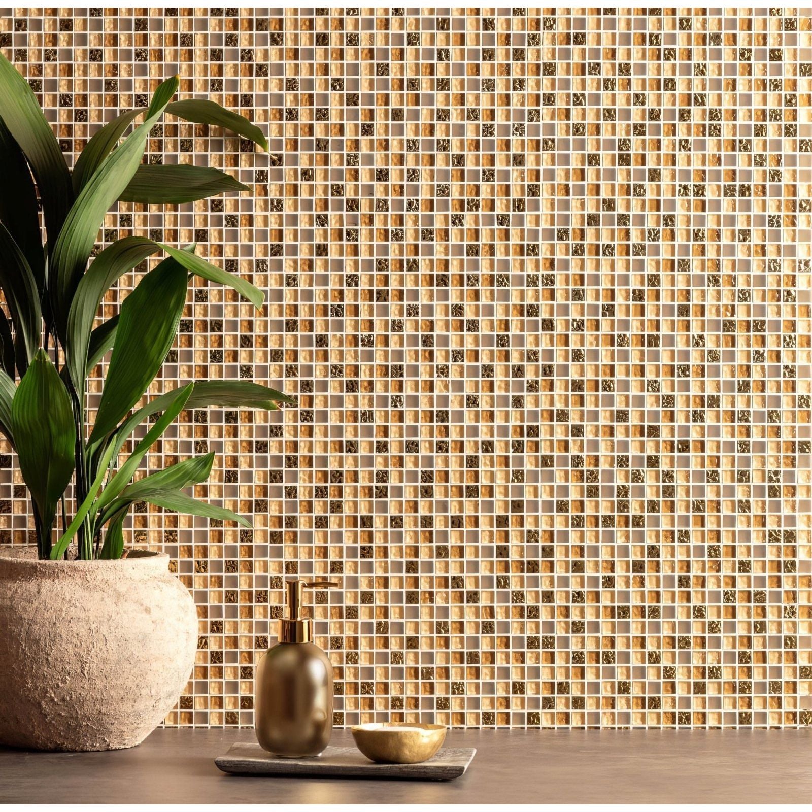 Gold-toned orla glass and stone mosaic tile wall with textured shimmering finish for decorative interiors