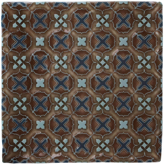 Brown ceramic tile ormeaux on chestnut with navy blue and light teal geometric cross pattern on textured earthy background