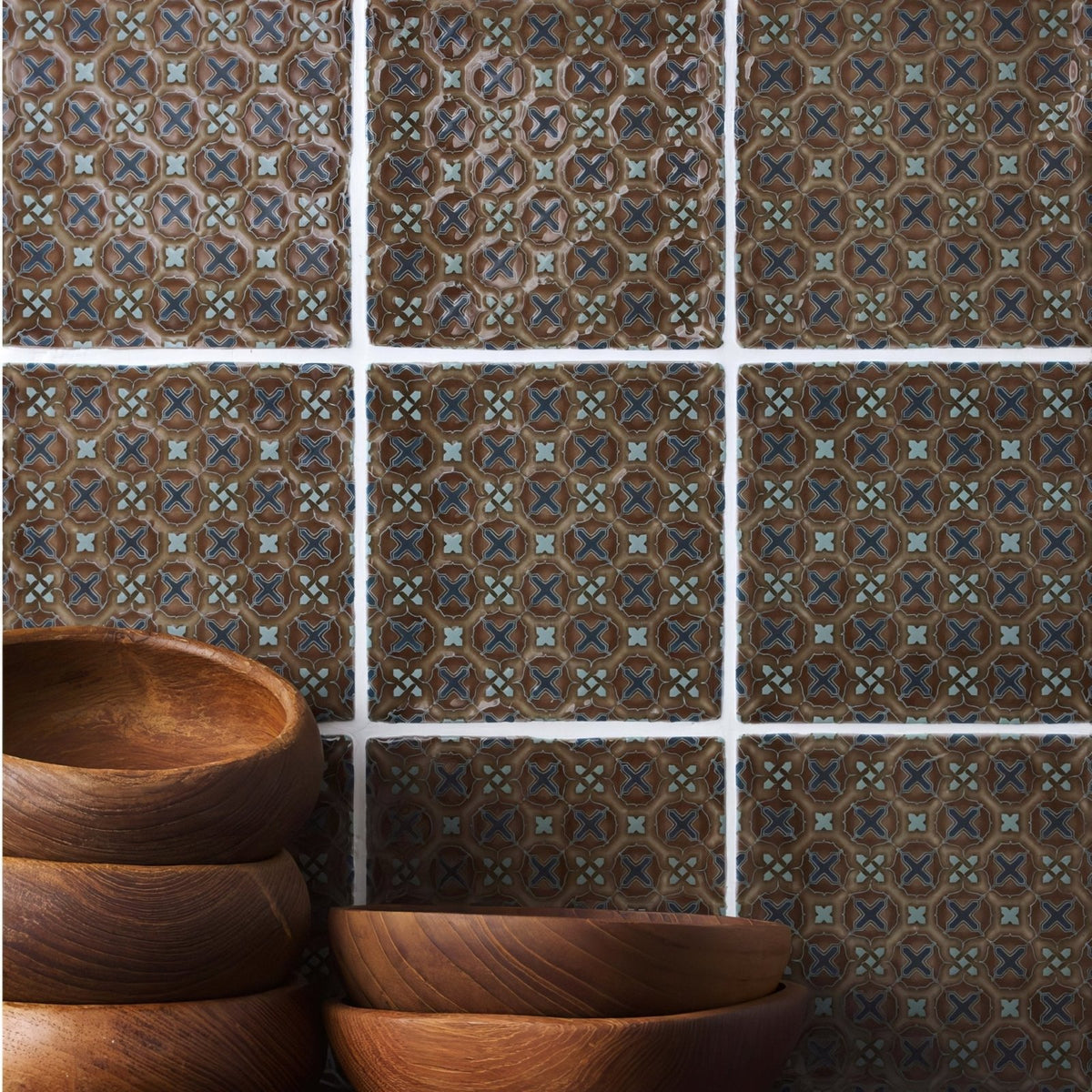 Stack of warm brown wooden bowls with visible grain and smooth rounded edges from ormeaux on chestnut collection