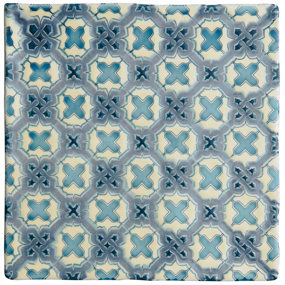 Square ceramic tile ormaux on palomino with a repeating geometric pattern in shades of blue and cream
