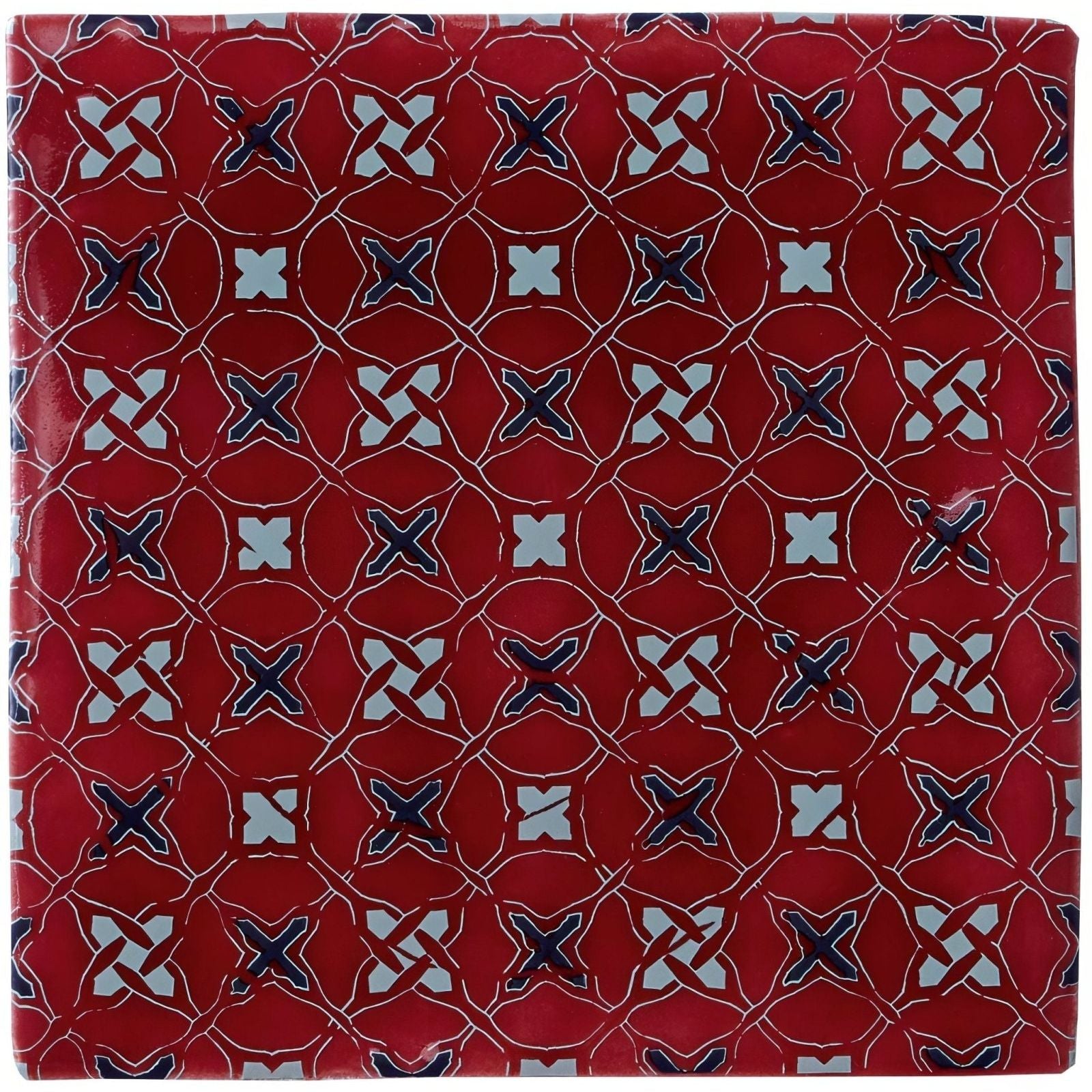 Red ceramic tile ormeaux on rioja with glossy finish and intricate white and navy blue geometric pattern
