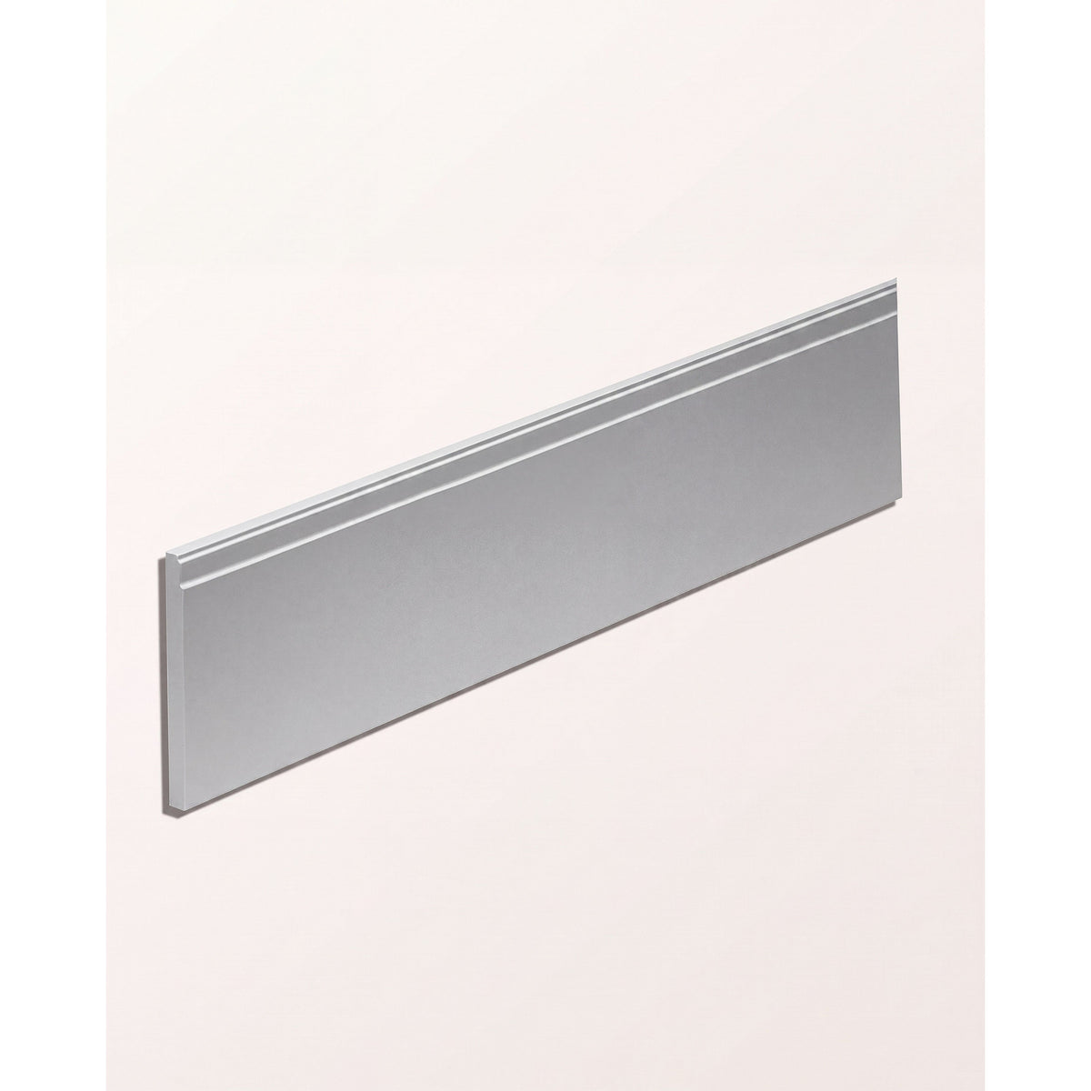 Ca'Pietra Ornamento Composite Skirting board shown at an angle, 13.3cm tall in wood and resin composite