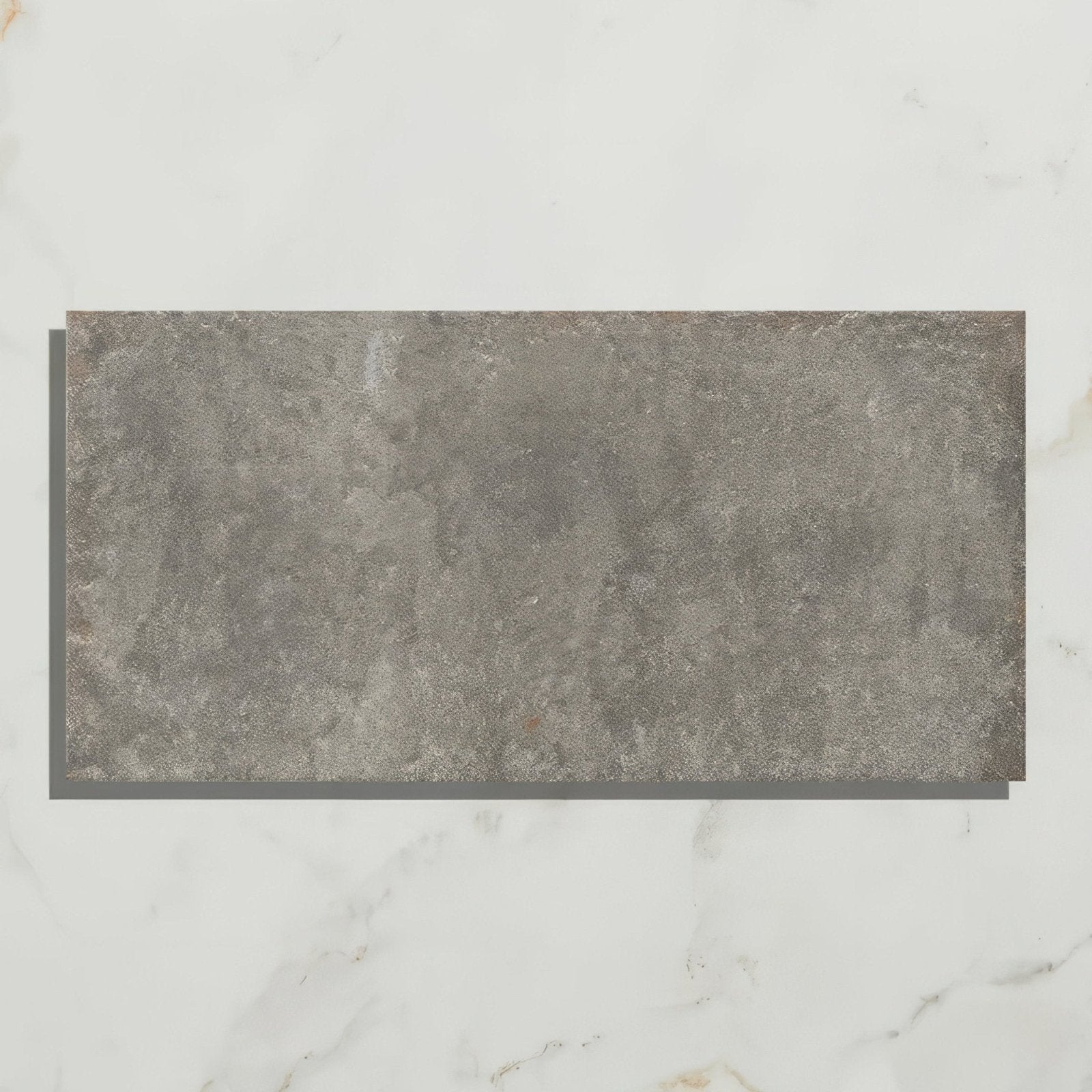Gray rectangular textured porcelain tile with stone-like surface from osterley porcelain black brick collection