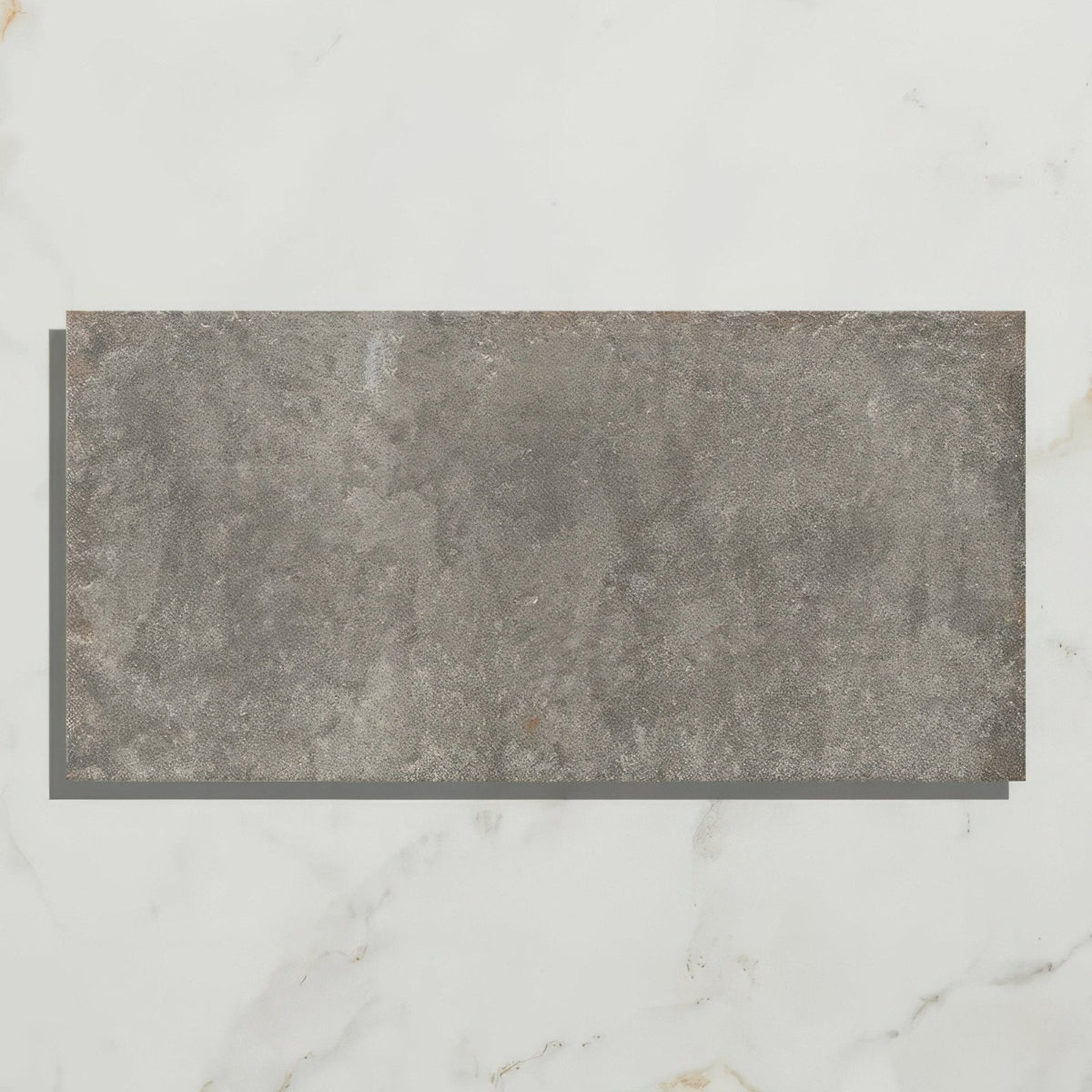 Gray rectangular textured porcelain tile with stone-like surface from osterley porcelain black brick collection