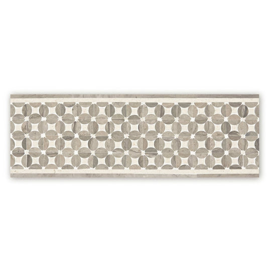 Palazzo mancini border rectangular mosaic tile with repeating circular gray marble inlays on a cream background
