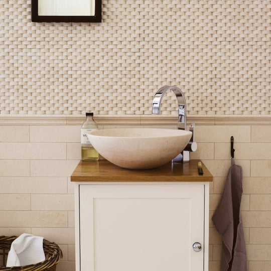 Beige stone vessel sink palio 60x30 diamond sawn edge honed with sleek chrome faucet on wooden countertop