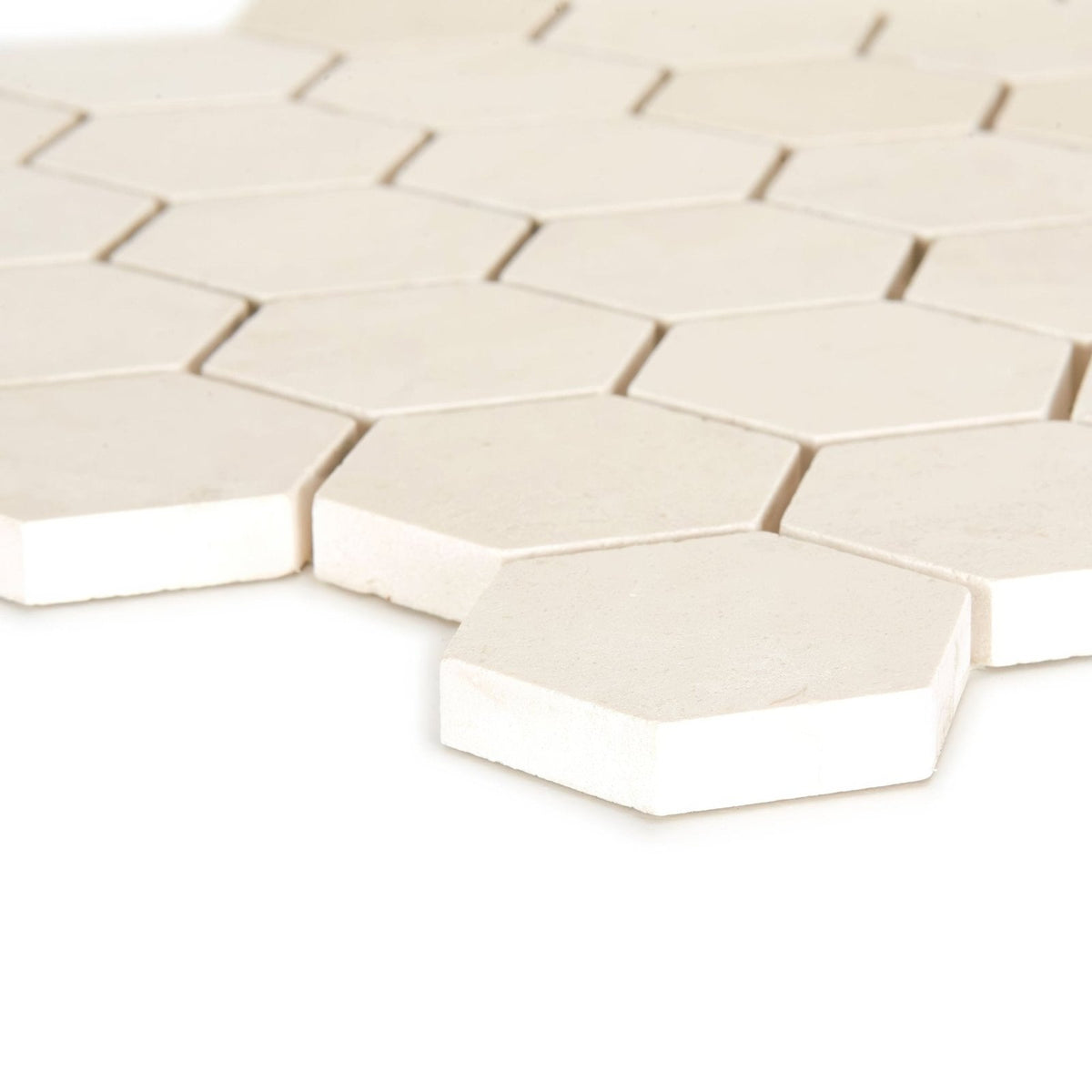 Off-white palio limestone hexagon mosaic tile with a smooth matte finish ideal for decorative wall and floor surfaces