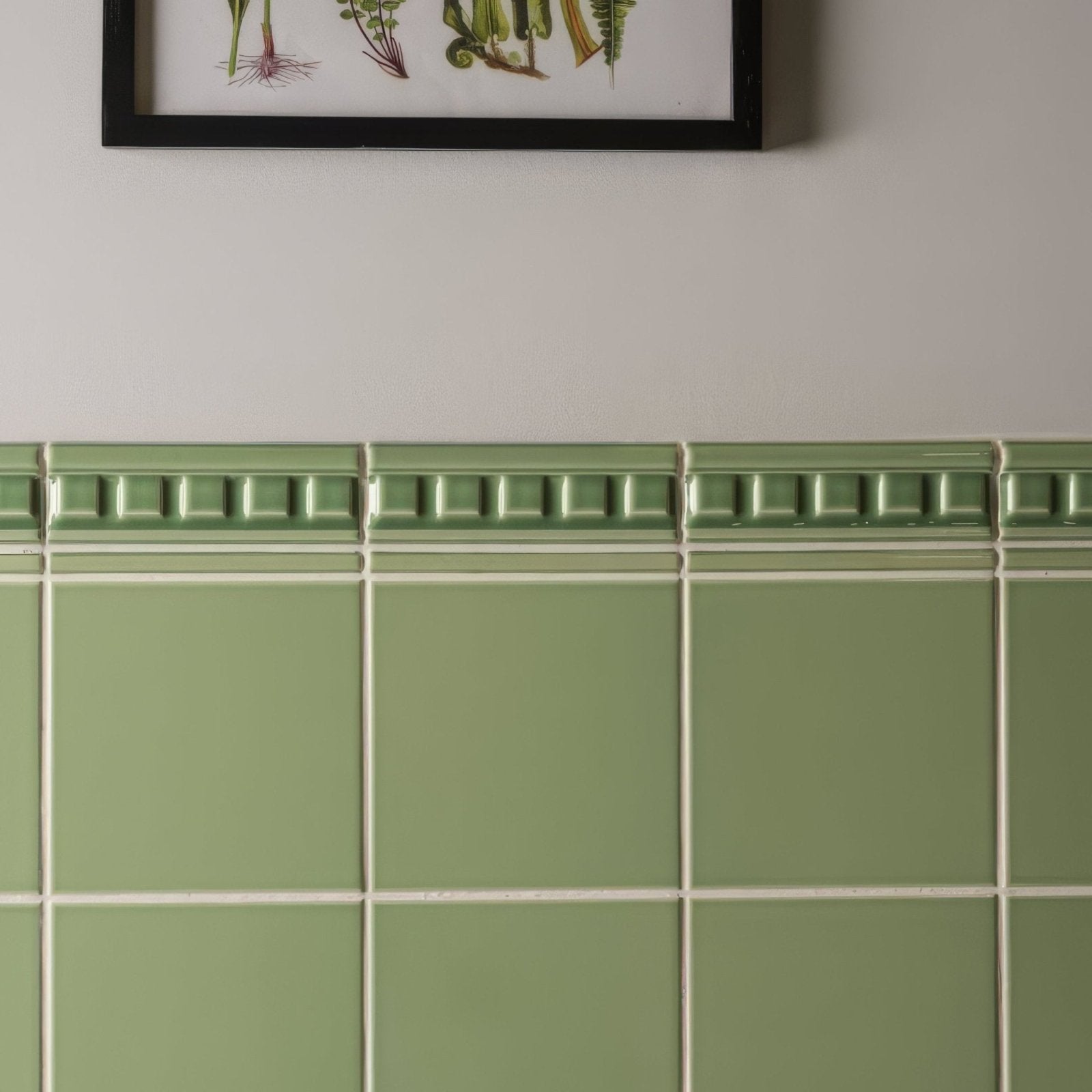 Palm green field tile featuring sage green ceramic tile with decorative raised border pattern for wall and floor use