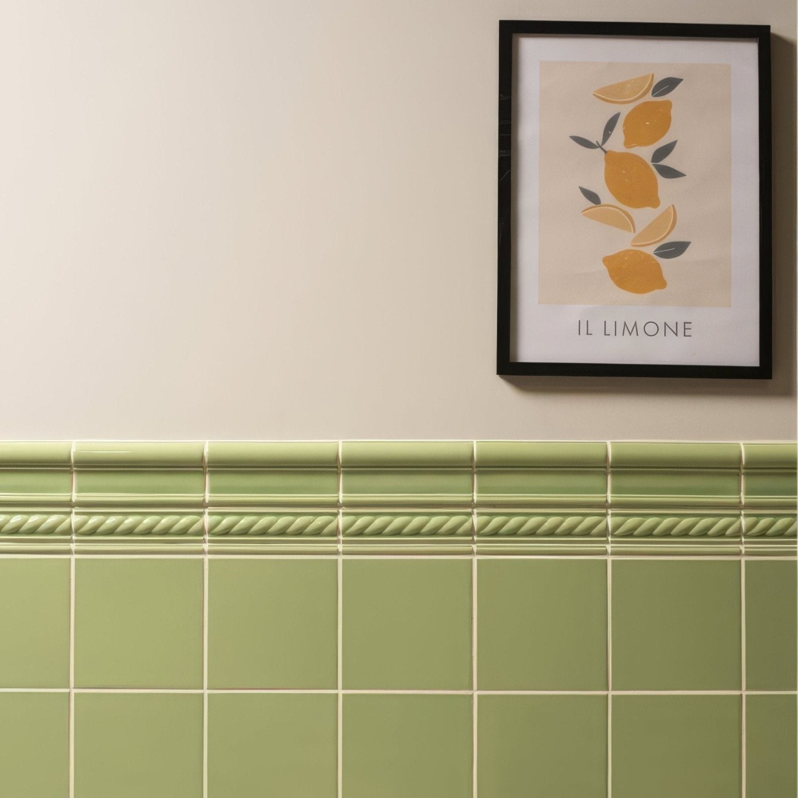 A framed artwork titled palm green field tile featuring minimalist yellow lemons and green leaves on off-white background