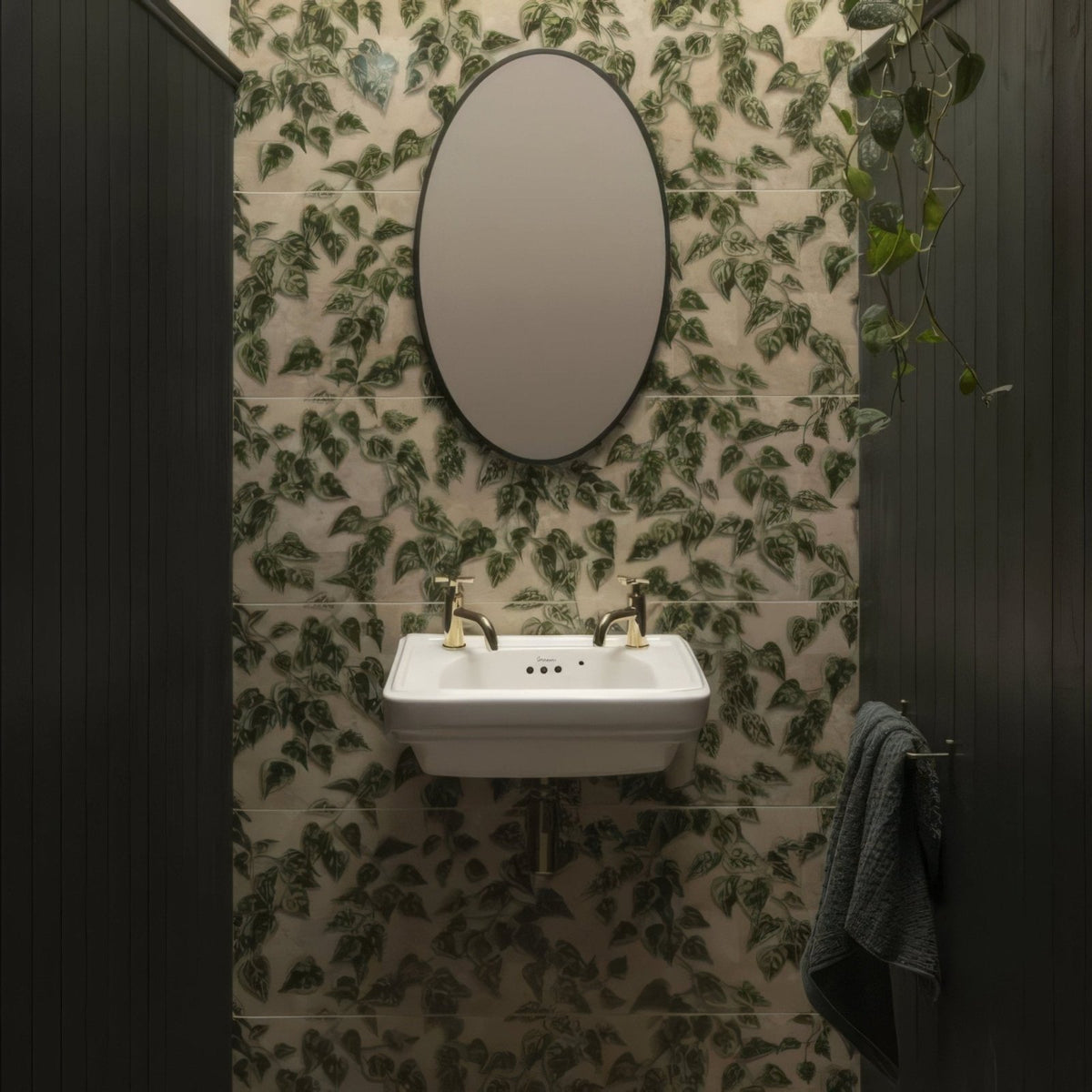 White ceramic wall-mounted sink with gold-toned faucets from palm house ivy single tile collection