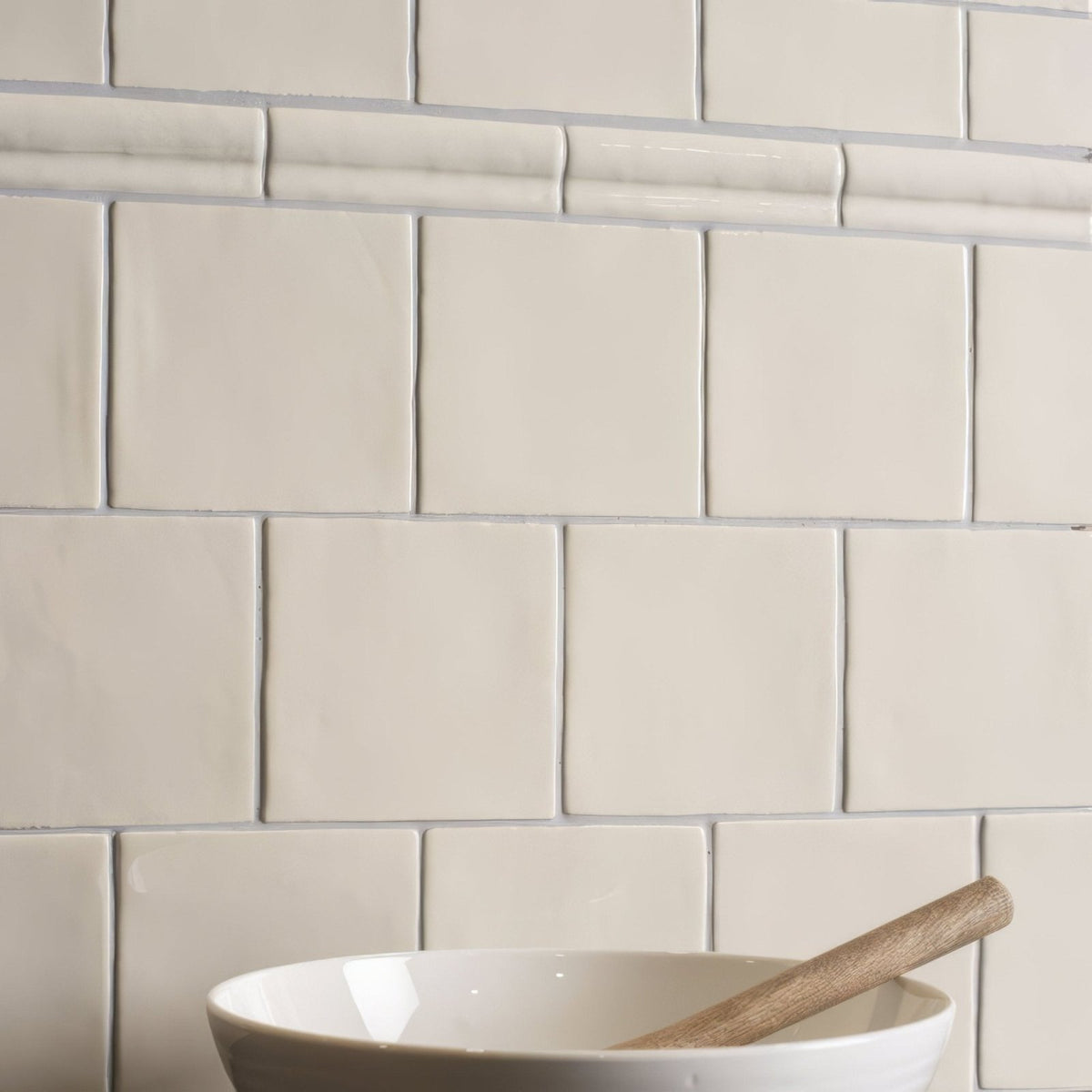 Cream-colored square ceramic palomino field tiles with glossy finish for modern kitchen backsplash