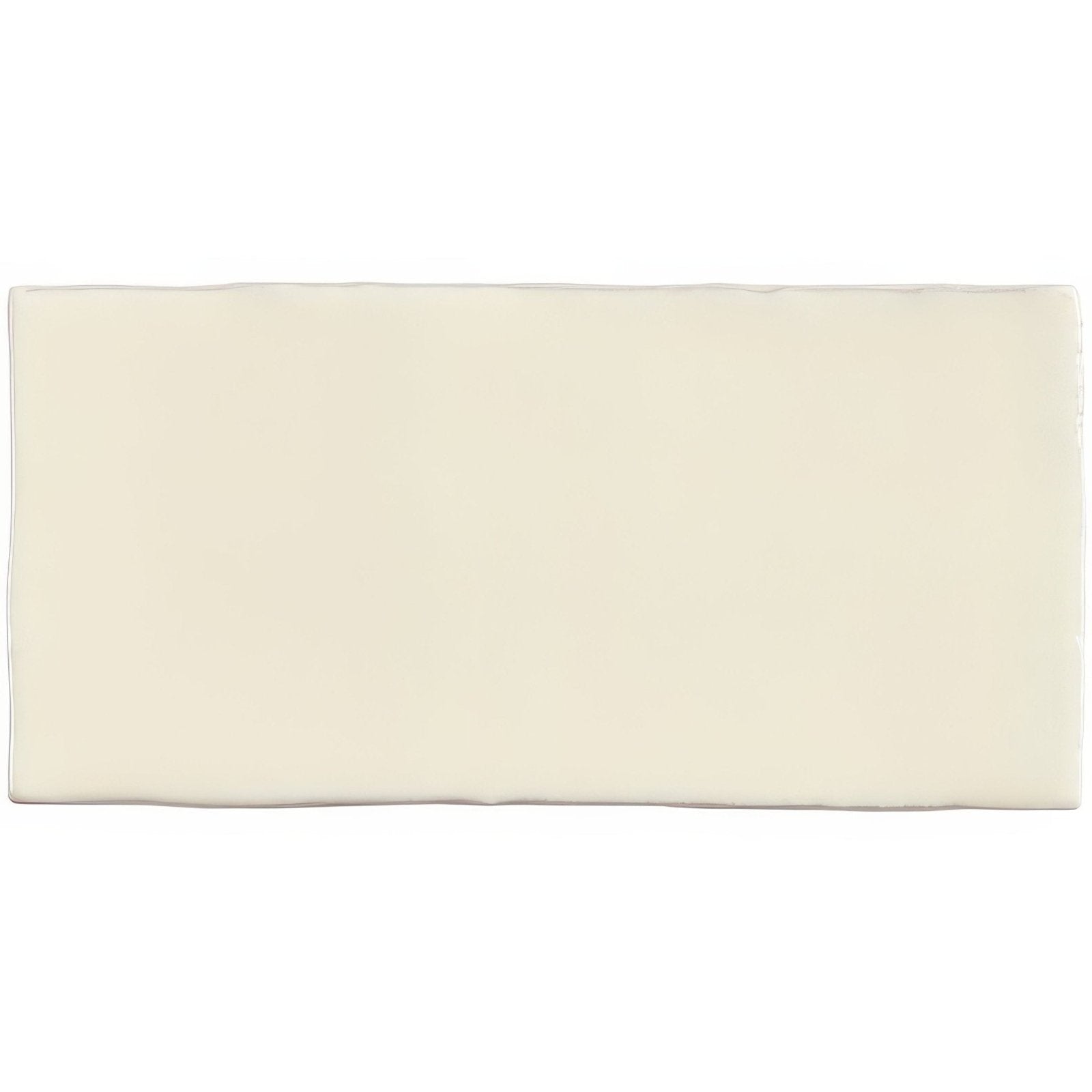 Cream-colored palomino half tile wall tile with smooth slightly glossy rectangular ceramic surface