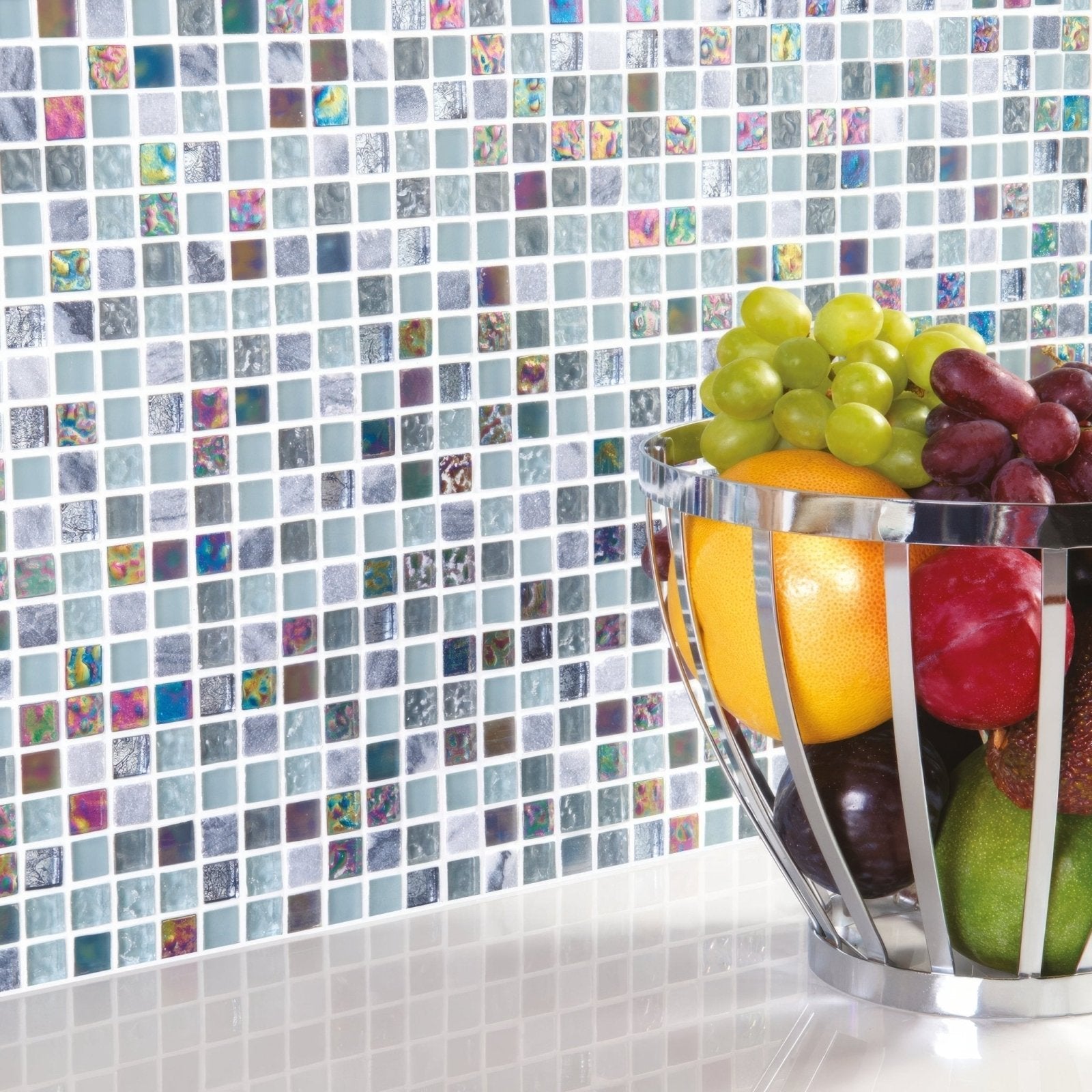 Pamplona Earth and Fire Mixed Mosaics grey and iridescent glass mosaic with a chrome fruit basket