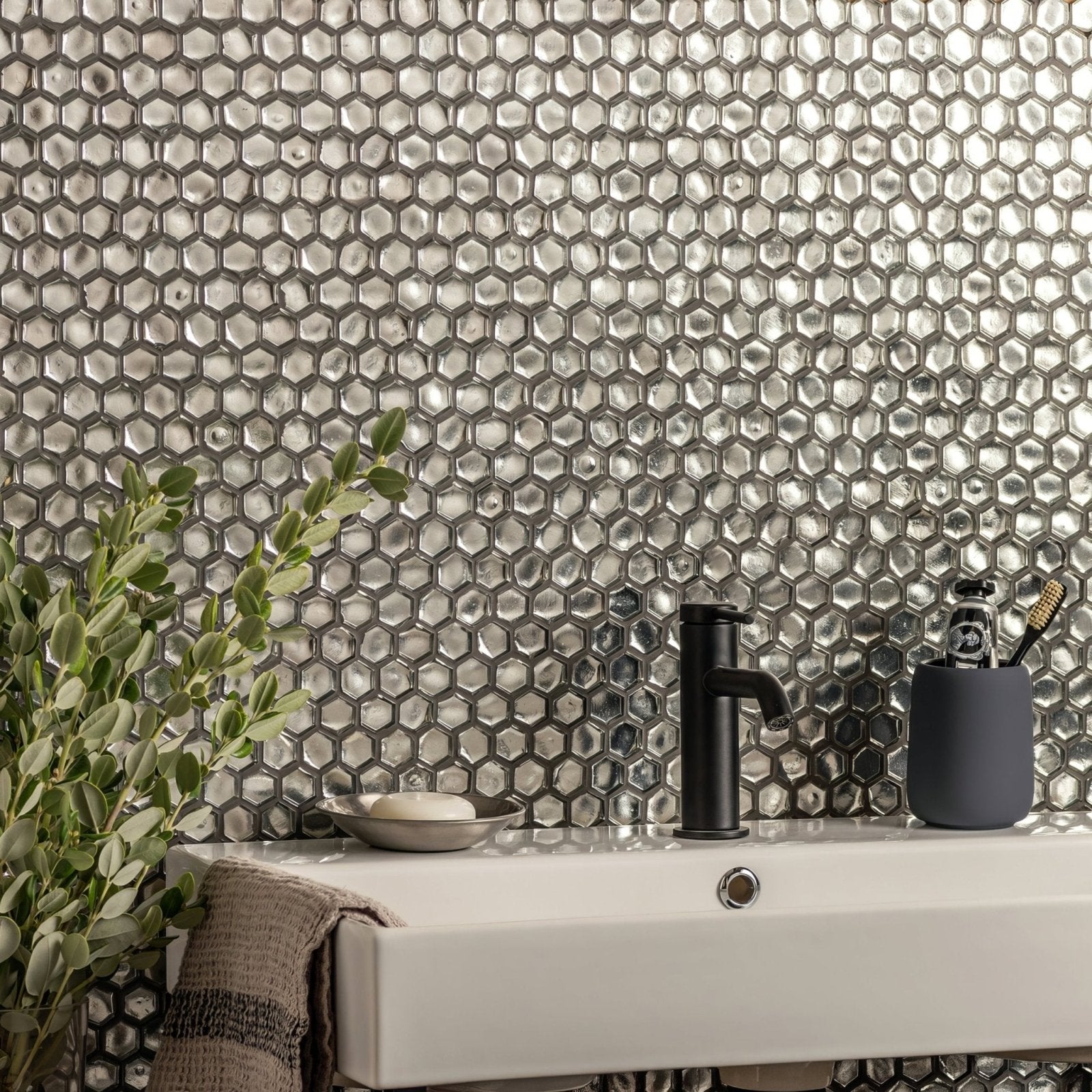 Silver hexagonal glass mosaic tile wall from panaji glass mosaic collection with reflective metallic finish