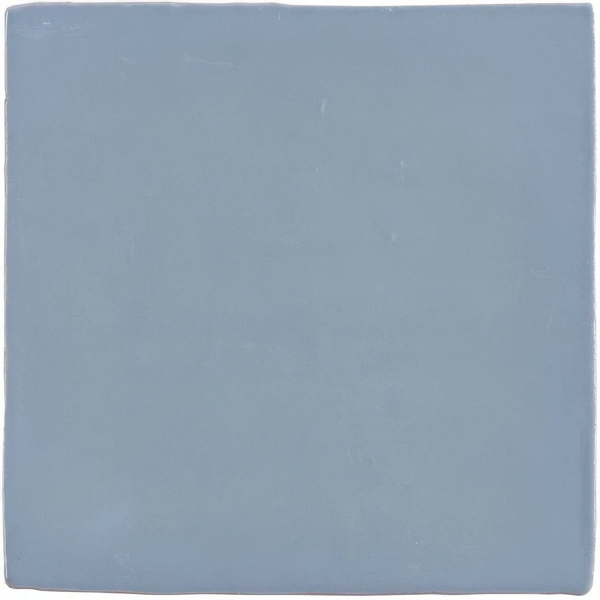 Pansy field tile is a square matte ceramic tile in a soft muted blue hue ideal for wall and floor use