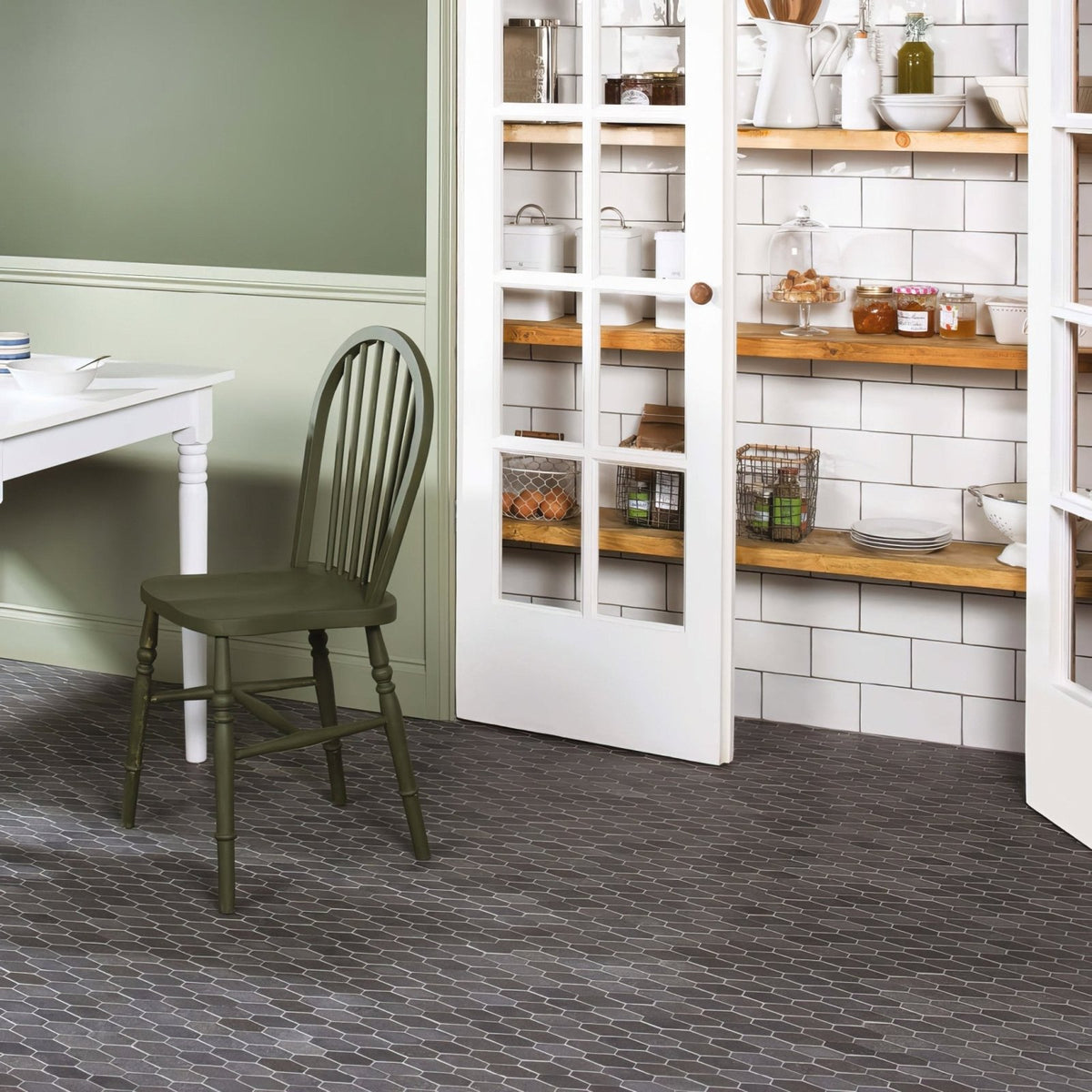 Dark green painted wooden chair with vertical spindles and solid seat featured alongside papyrus brick tile product