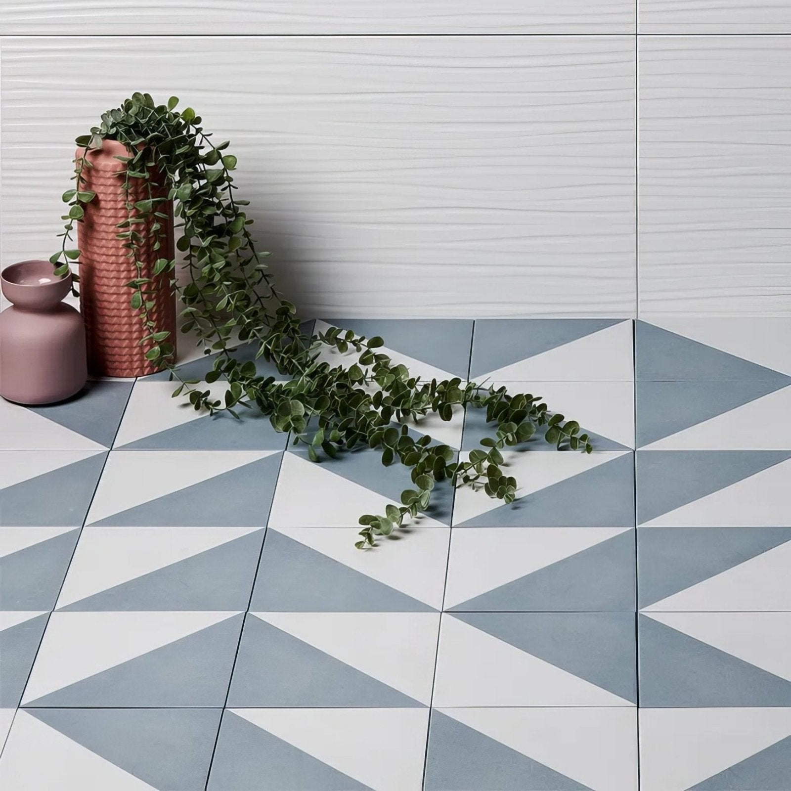 Geometric patterned parisian café porcelain tri blue floor tiles in white and light gray with a triangular design