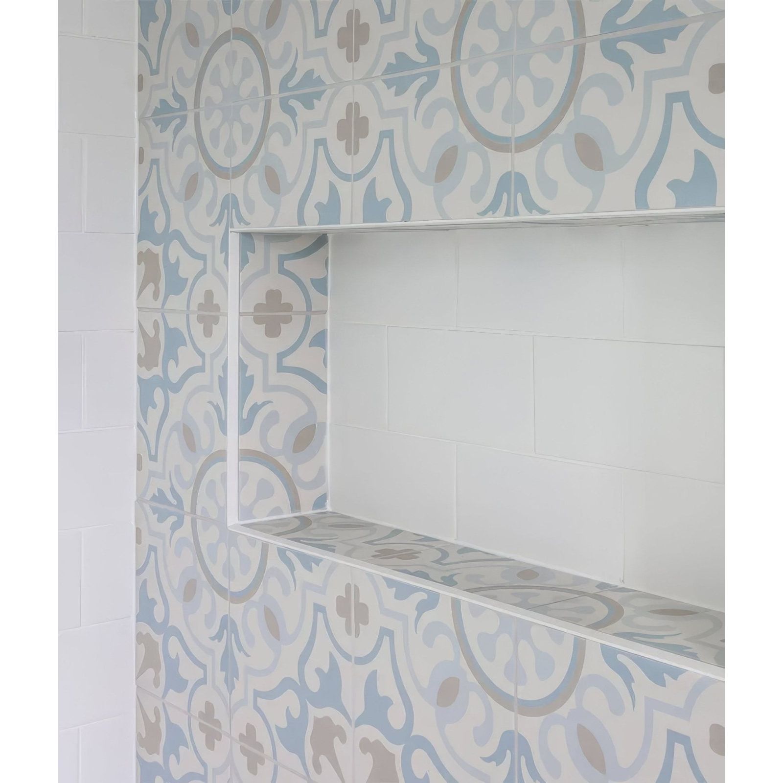 Built-in bathroom shelf with white frame and Parisian Chic Porcelain Paix patterned tiles in blue gray and beige