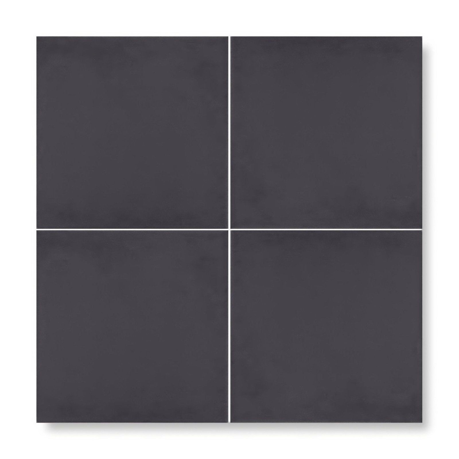 Four matte black porcelain patisserie dark base tiles arranged in a square grid for flooring or walls
