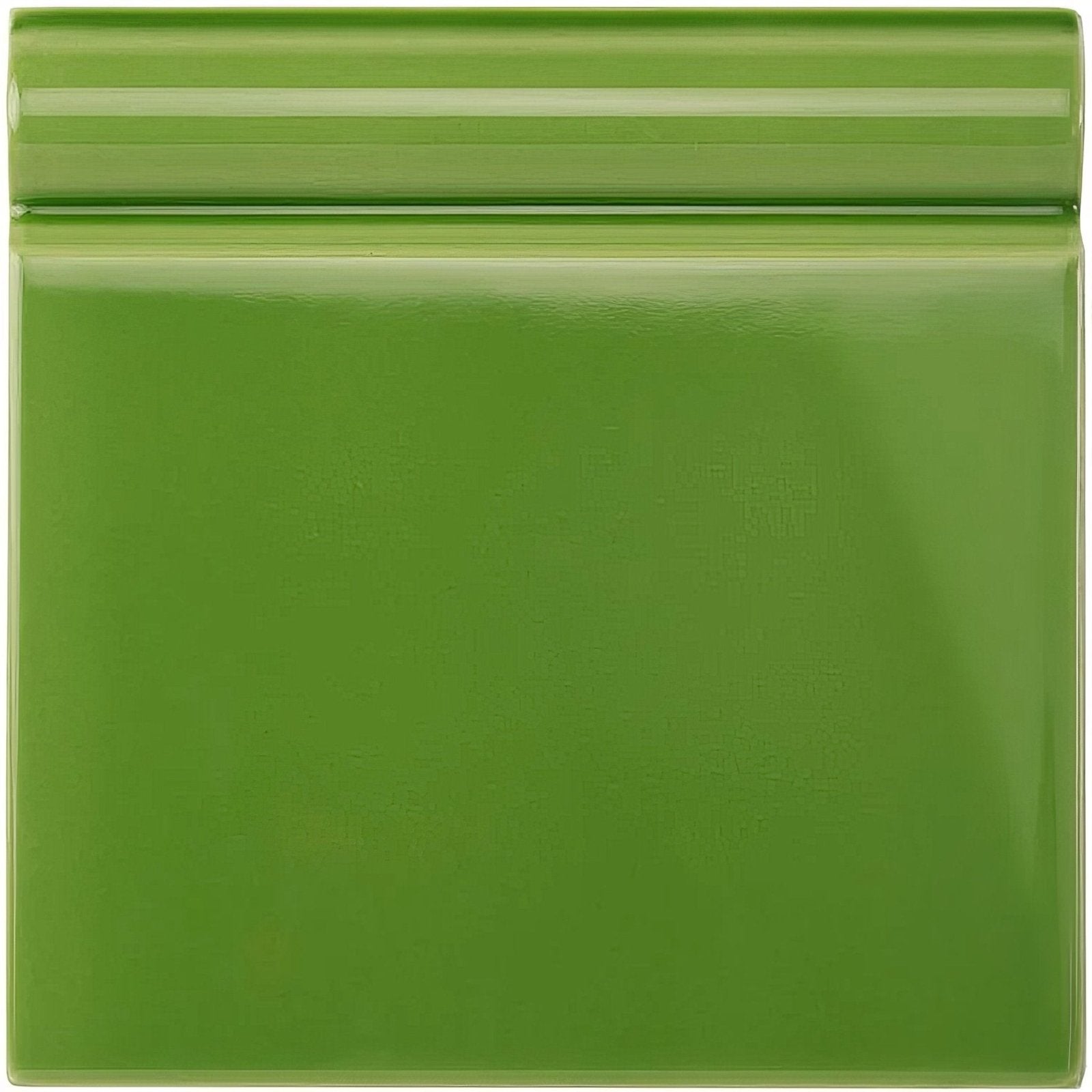A glossy green ceramic pavilion skirting tile with a subtle ridged border and square shape