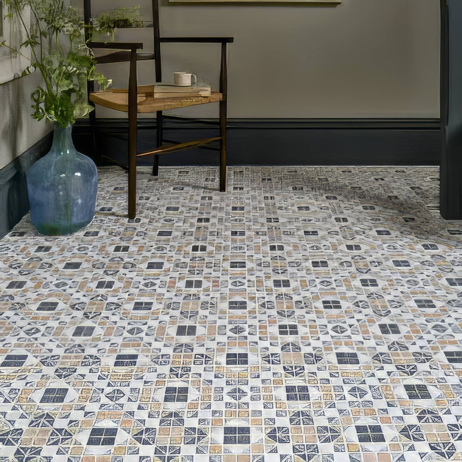 Pavilion Porcelain Marine Blue geometric porcelain mosaic with a blue glass vase of greenery